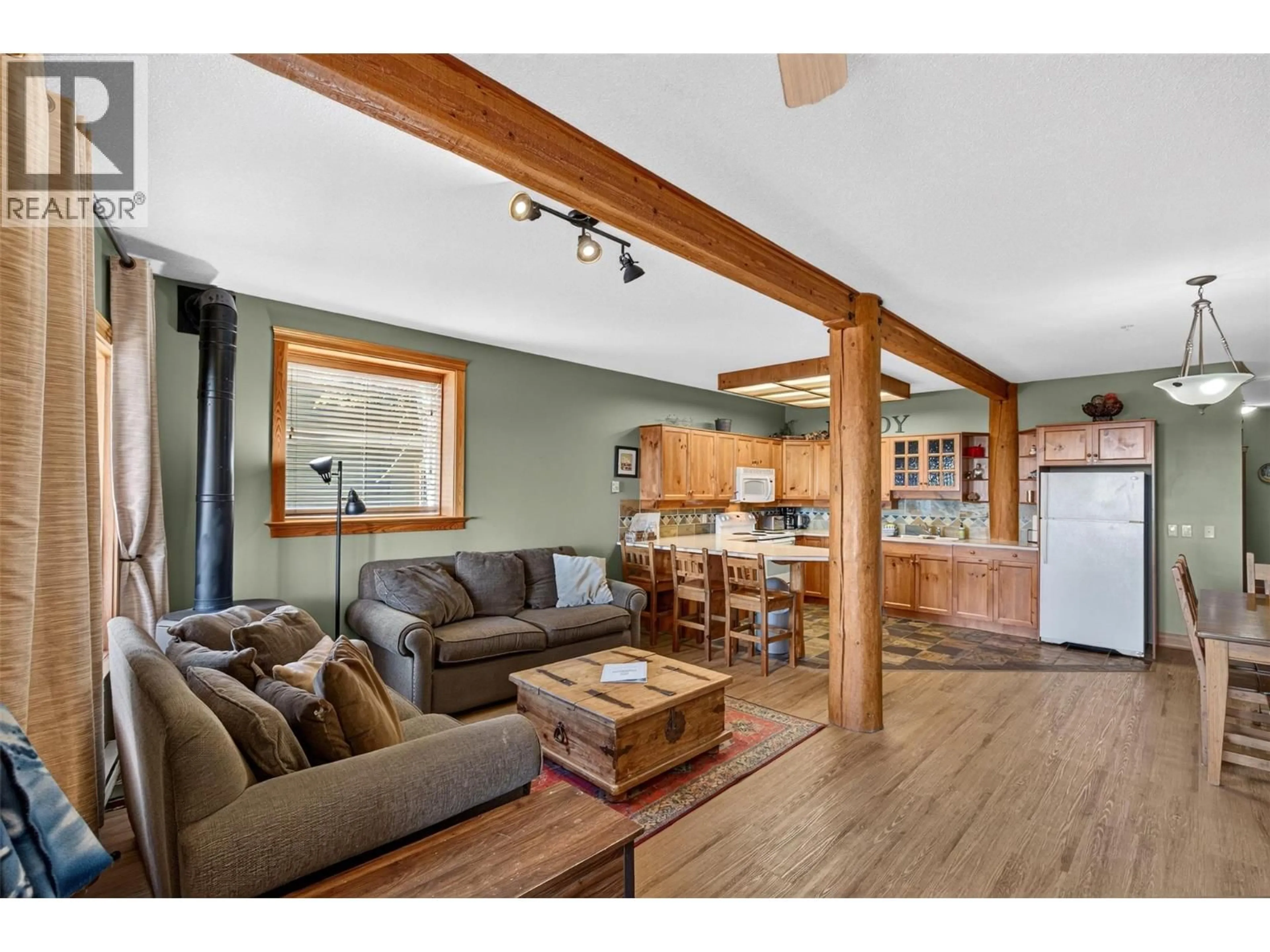 Open concept kitchen, wood/laminate floor for A - 5873 SNOW PINES CRESCENT, Big White British Columbia V1P1T4