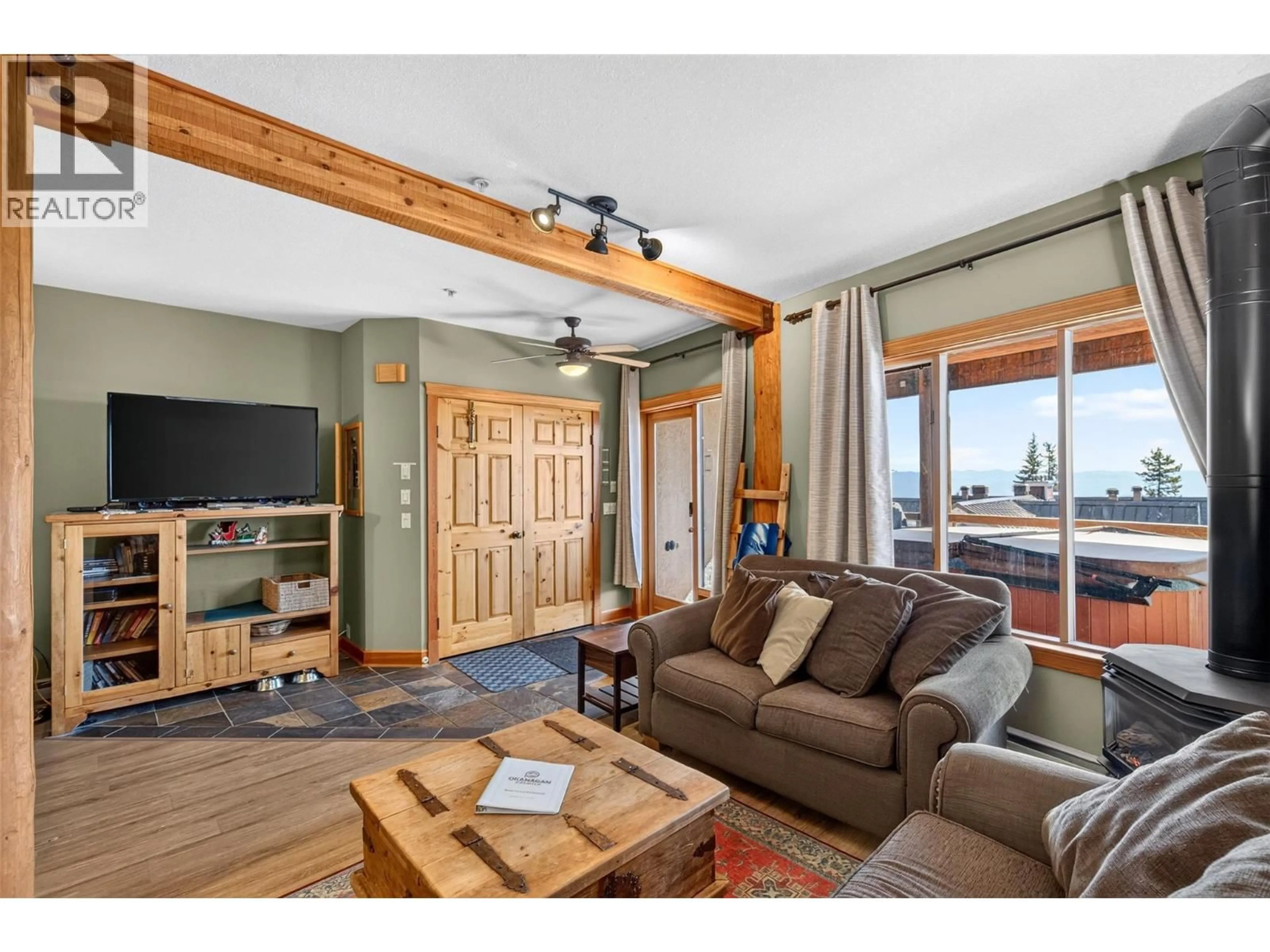 Living room with furniture, wood/laminate floor for A - 5873 SNOW PINES CRESCENT, Big White British Columbia V1P1T4