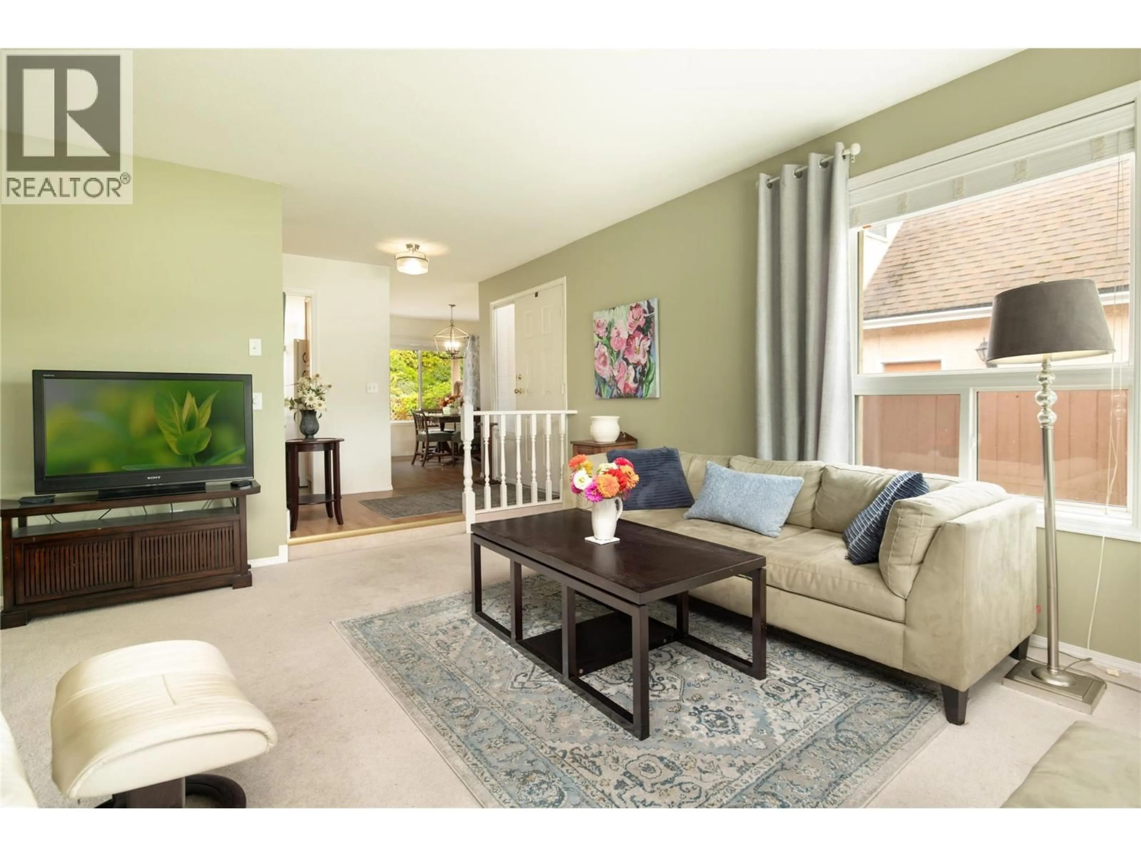 Living room with furniture, unknown for 1888 PORTHILL DRIVE, Kelowna British Columbia V1V1R9
