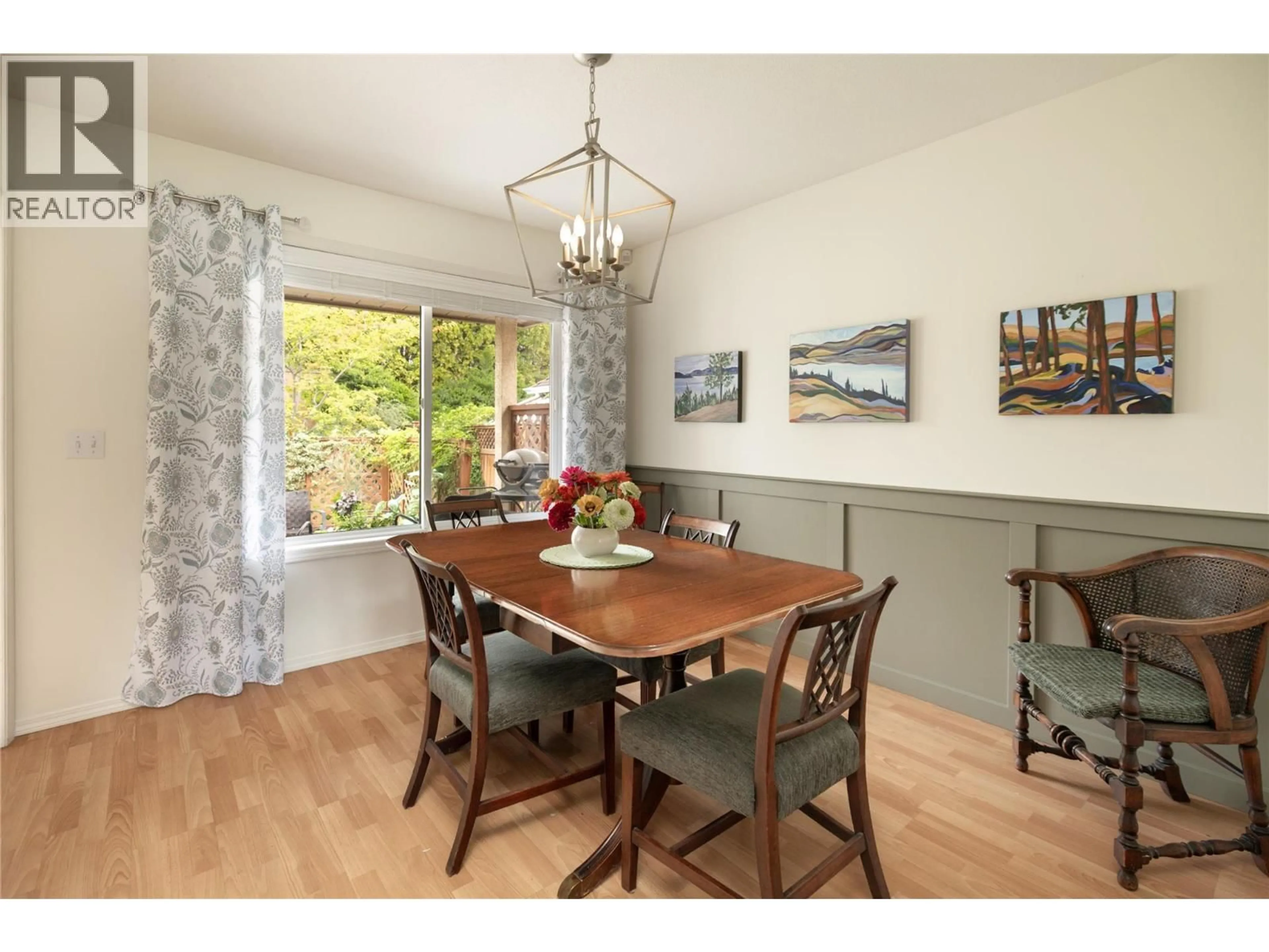 Dining room, wood/laminate floor for 1888 PORTHILL DRIVE, Kelowna British Columbia V1V1R9