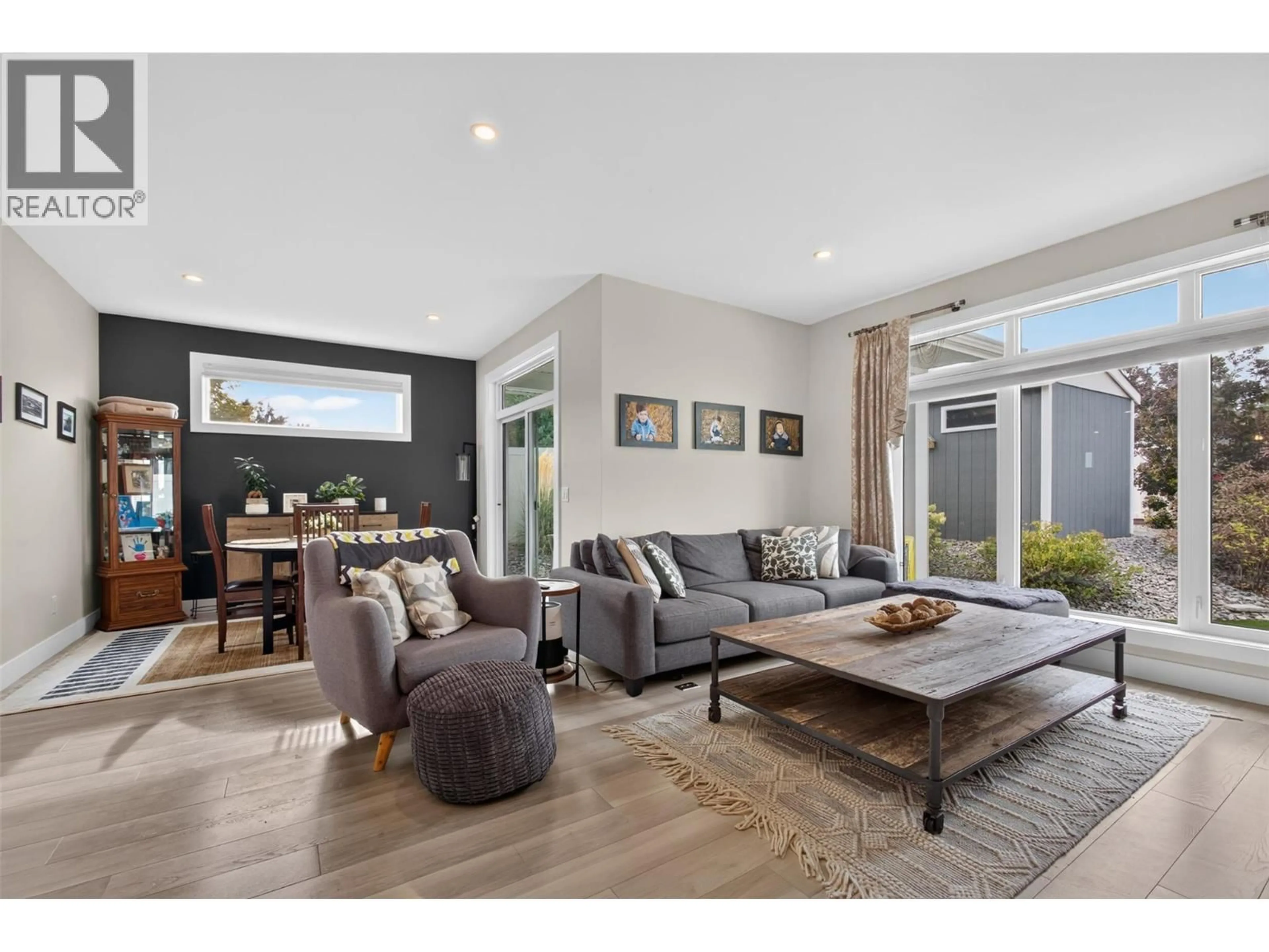Living room with furniture, wood/laminate floor for 2400 HAWKS BOULEVARD, West Kelowna British Columbia V4T0A7