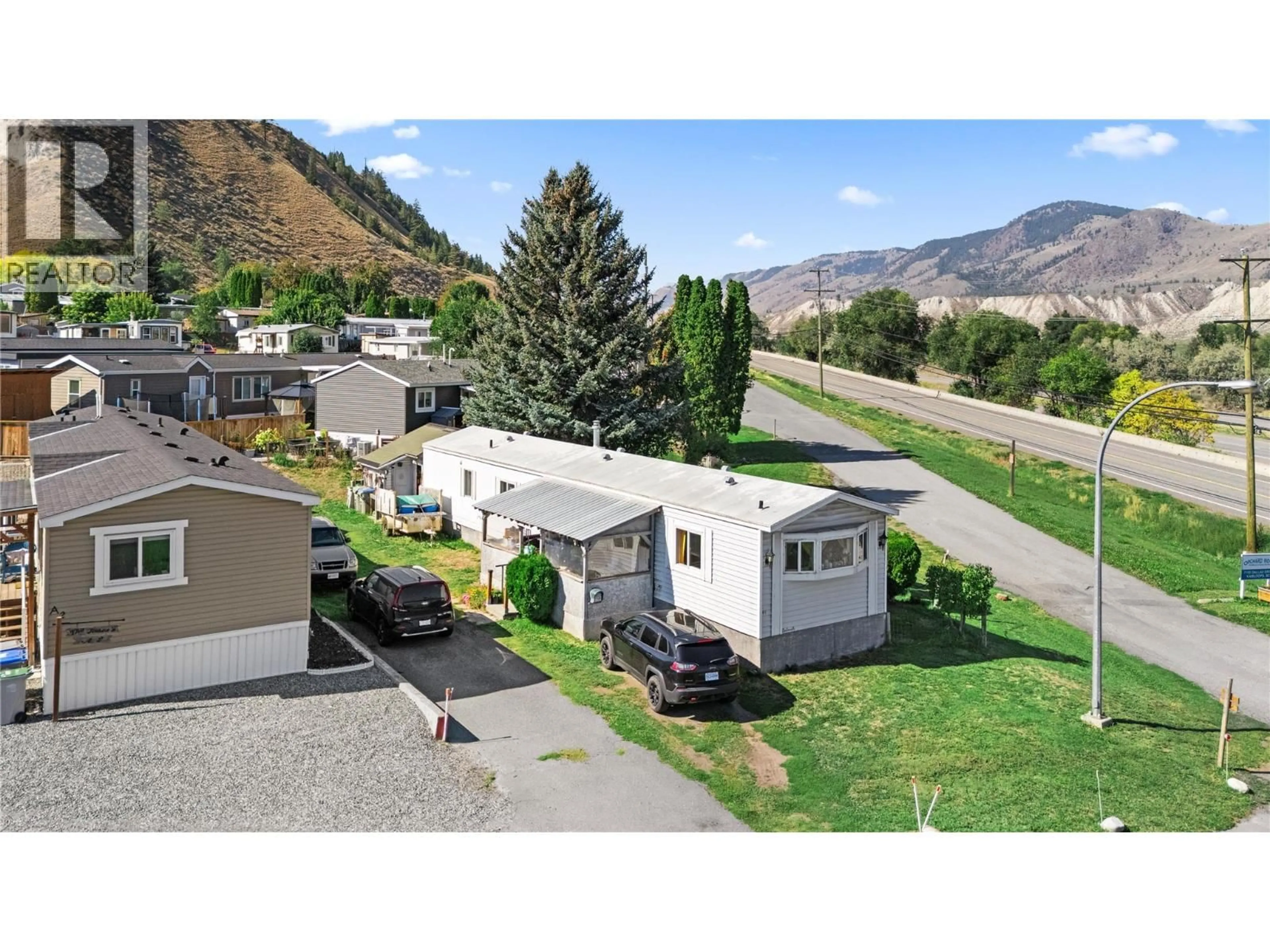 A pic from outside/outdoor area/front of a property/back of a property/a pic from drone, mountain view for A1 - 7155 DALLAS DRIVE, Kamloops British Columbia V2C4T1