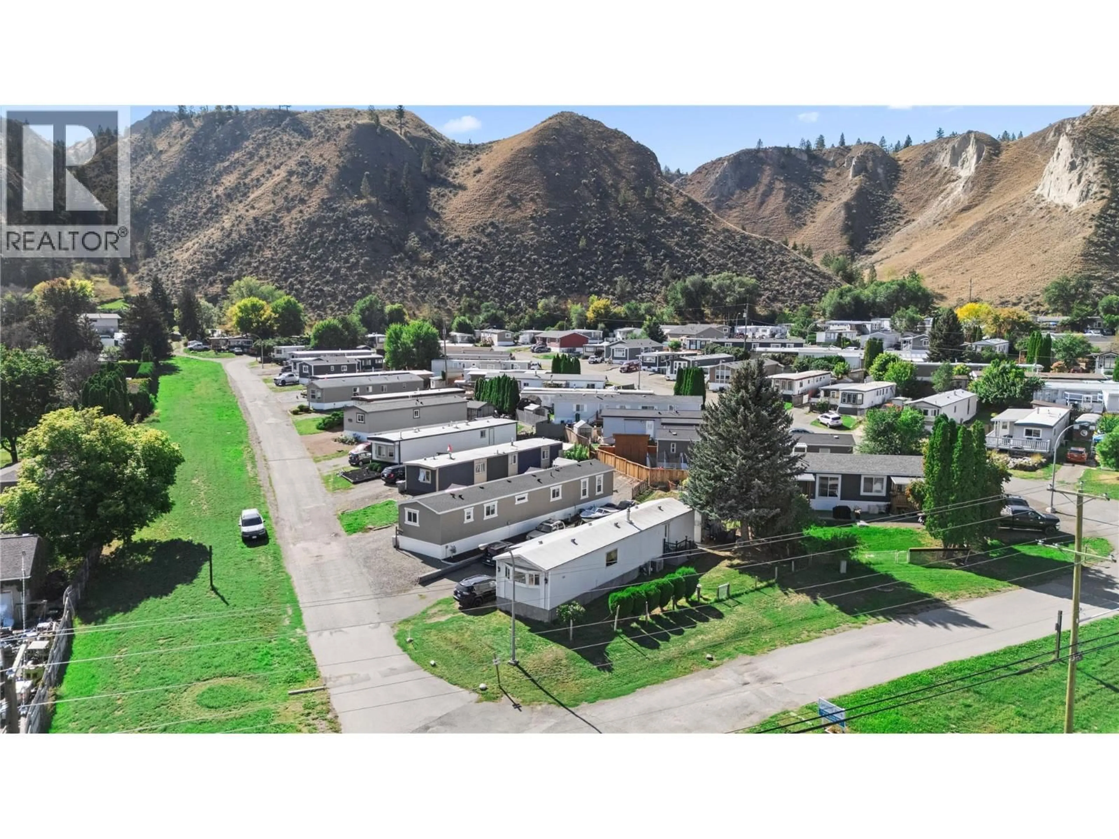 A pic from outside/outdoor area/front of a property/back of a property/a pic from drone, mountain view for A1 - 7155 DALLAS DRIVE, Kamloops British Columbia V2C4T1