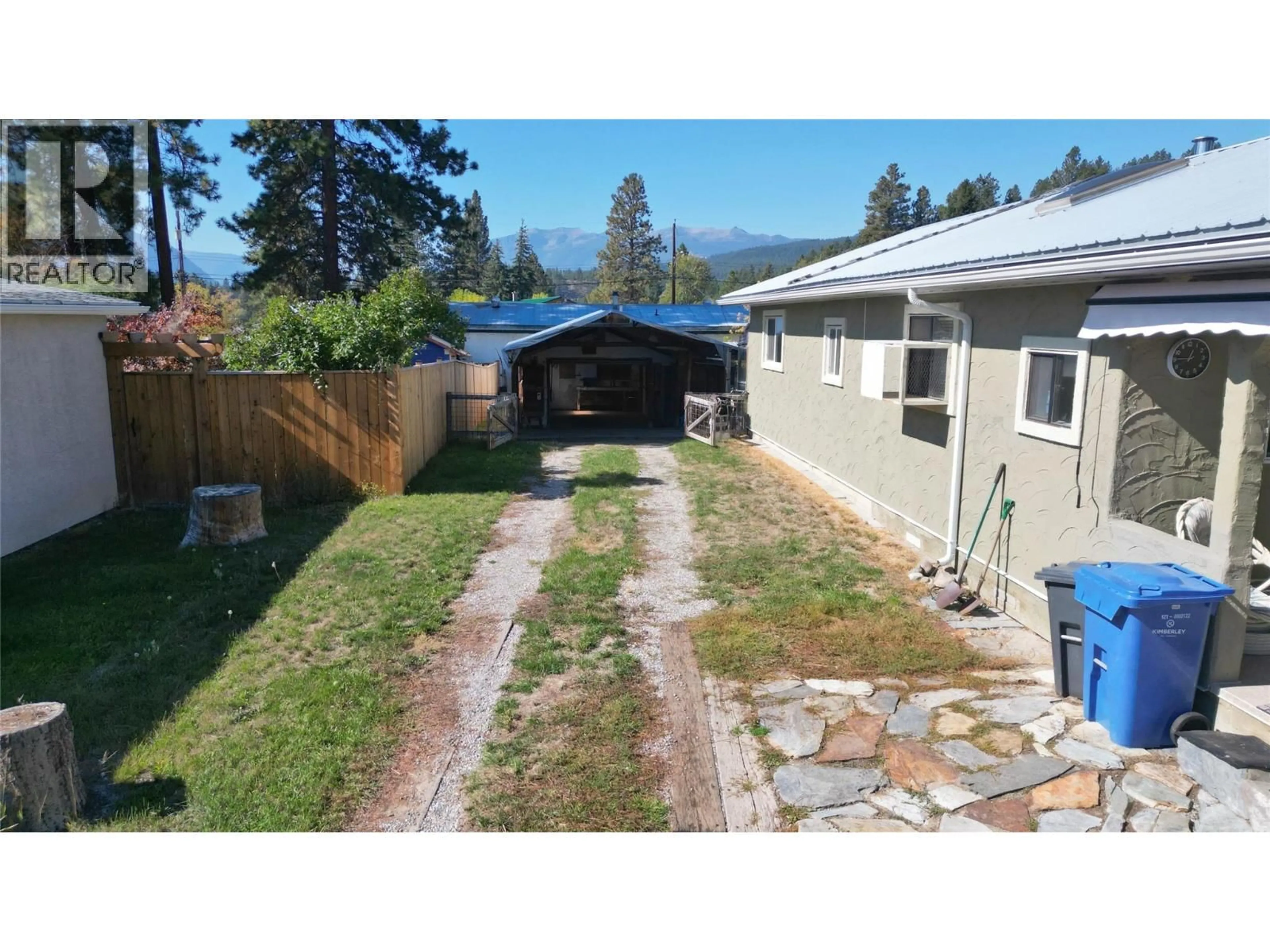 A pic from outside/outdoor area/front of a property/back of a property/a pic from drone, water/lake/river/ocean view for 113 311 AVENUE, Kimberley British Columbia V1A3J6