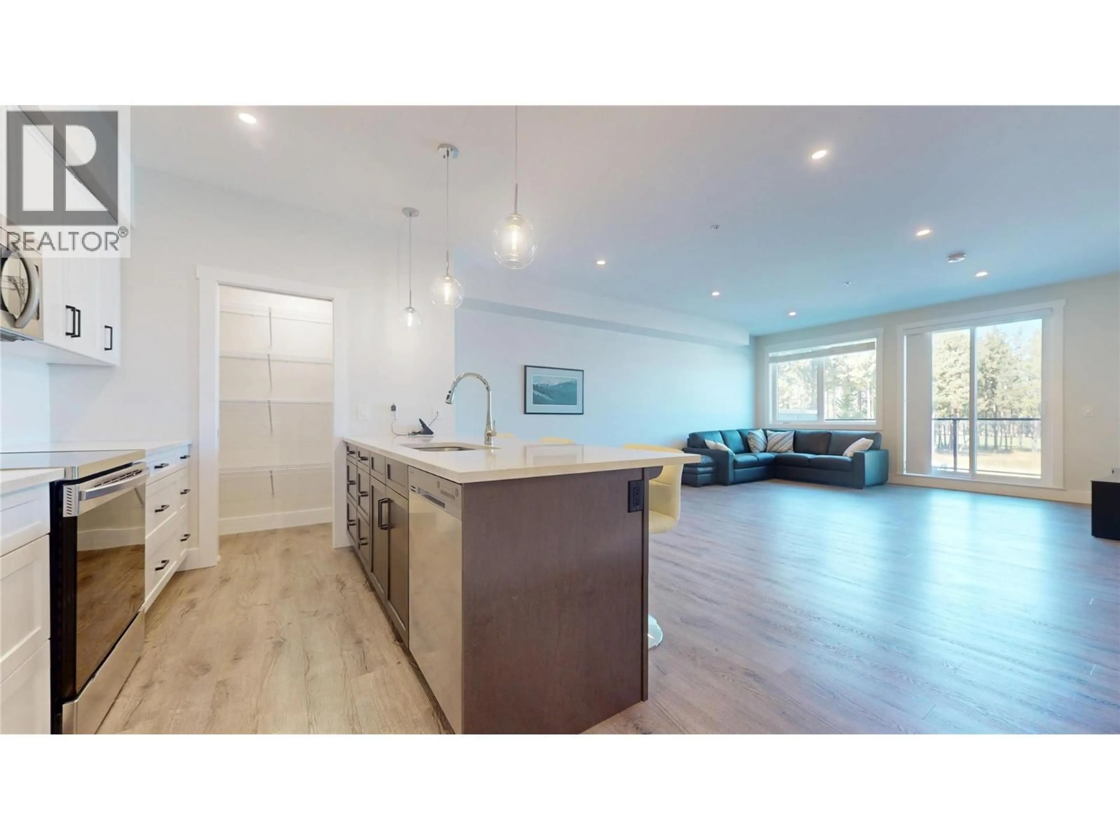 Open concept kitchen, wood/laminate floor for 202 - 355 LEGACY LOOKOUT, Cranbrook British Columbia V1C0E6