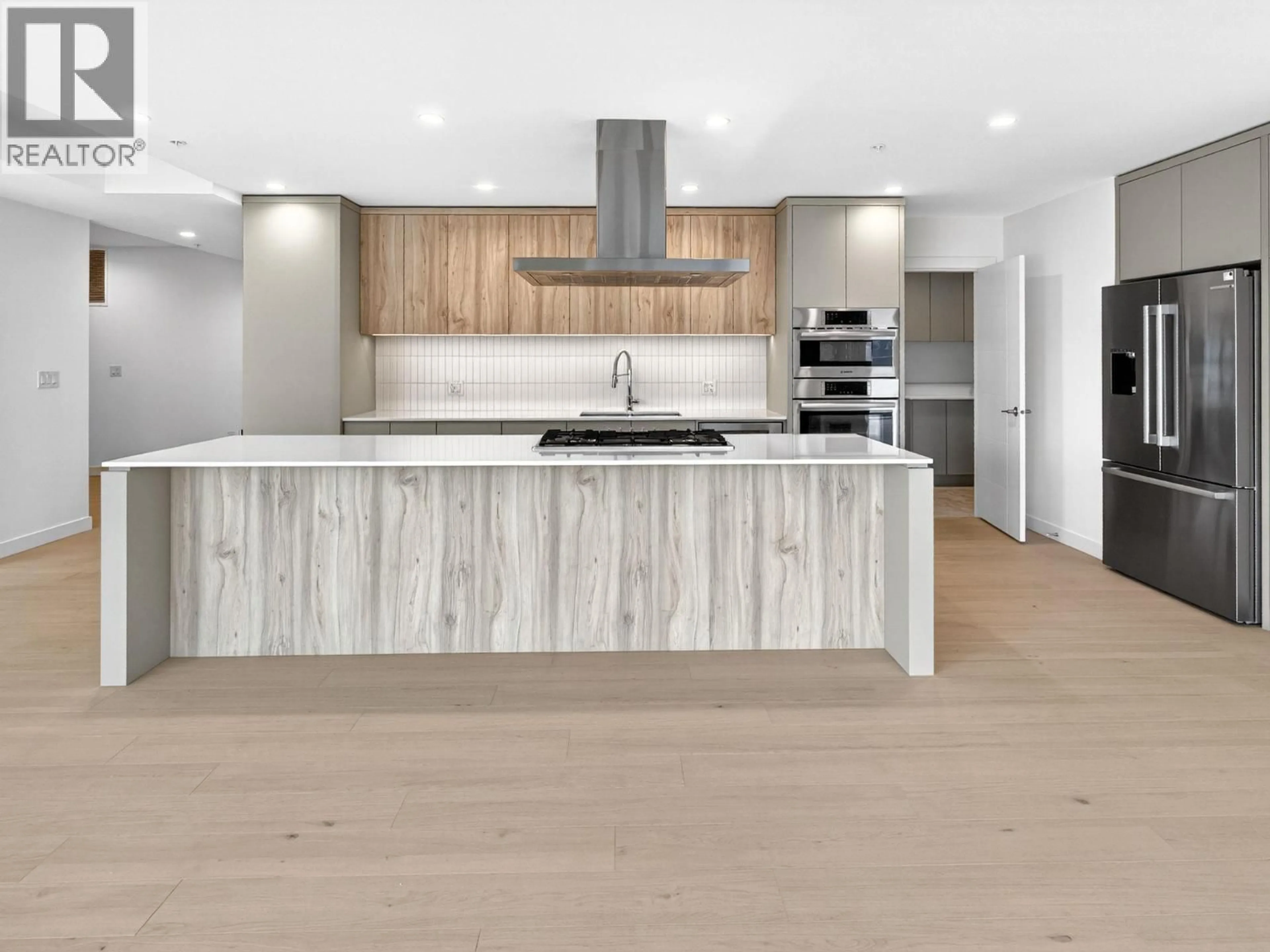 Open concept kitchen, wood/laminate floor for 202 - 13415 LAKESHORE DRIVE SOUTH, Summerland British Columbia V0H1Z1