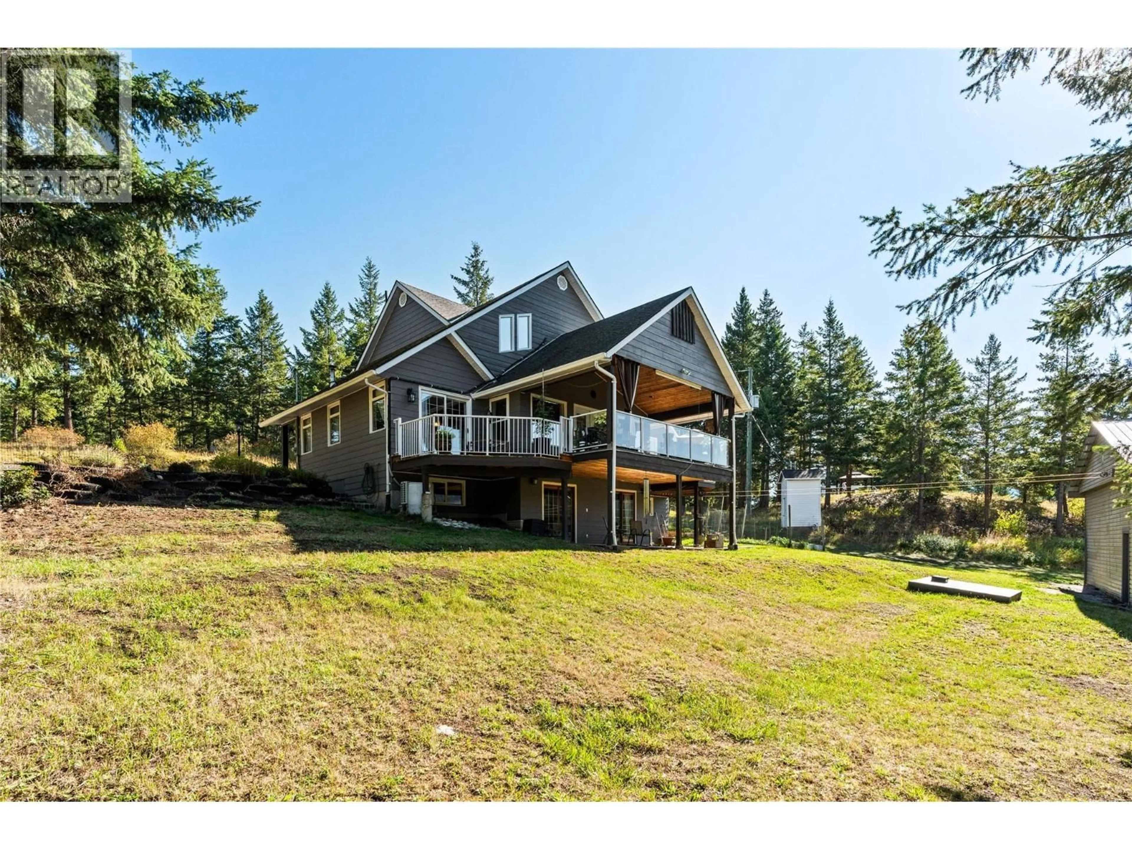 A pic from outside/outdoor area/front of a property/back of a property/a pic from drone, water/lake/river/ocean view for 59 RAWLINGS LAKE ROAD, Lumby British Columbia V0E2G1