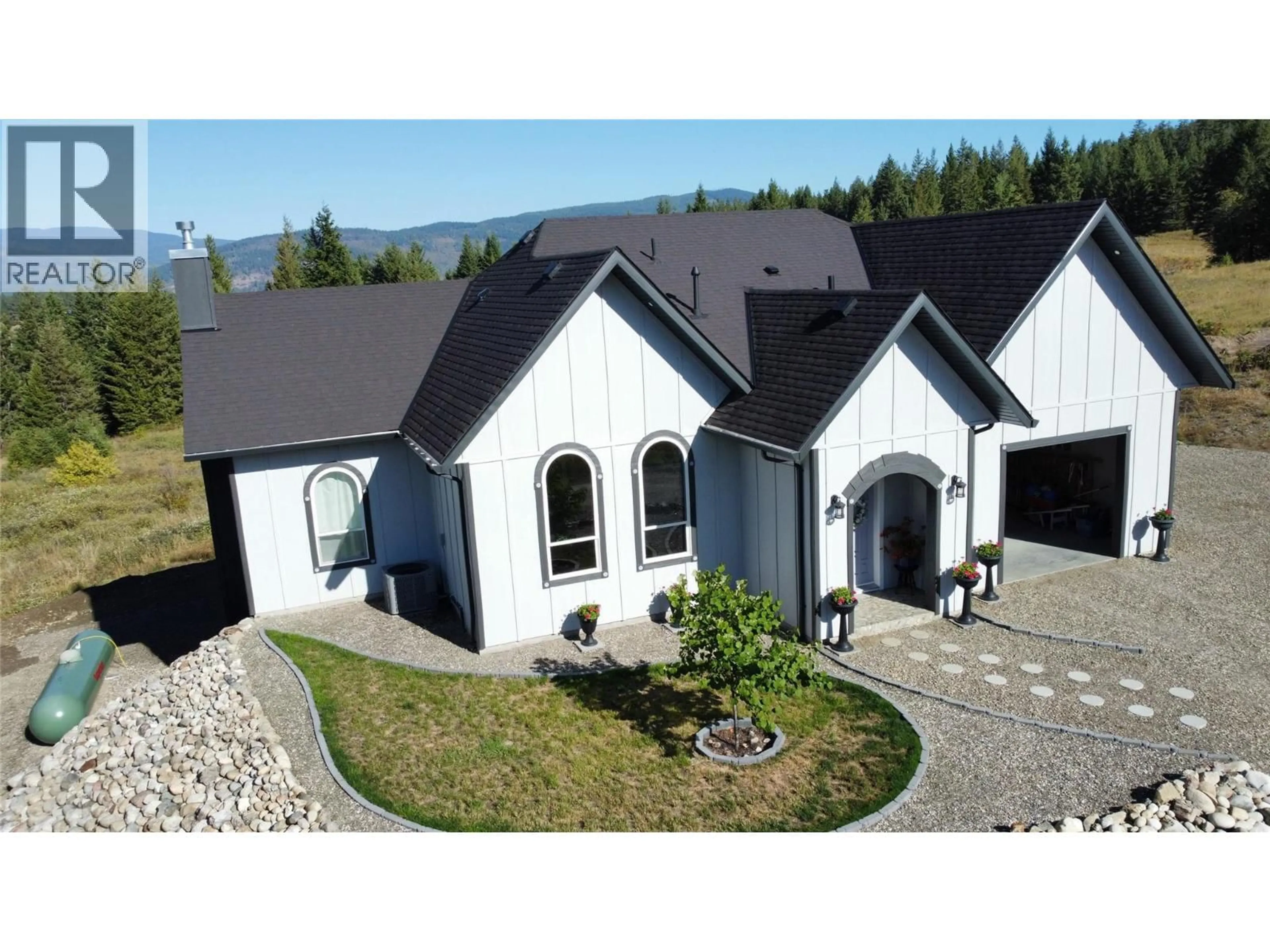 A pic from outside/outdoor area/front of a property/back of a property/a pic from drone, mountain view for 59 RAWLINGS LAKE ROAD, Lumby British Columbia V0E2G1