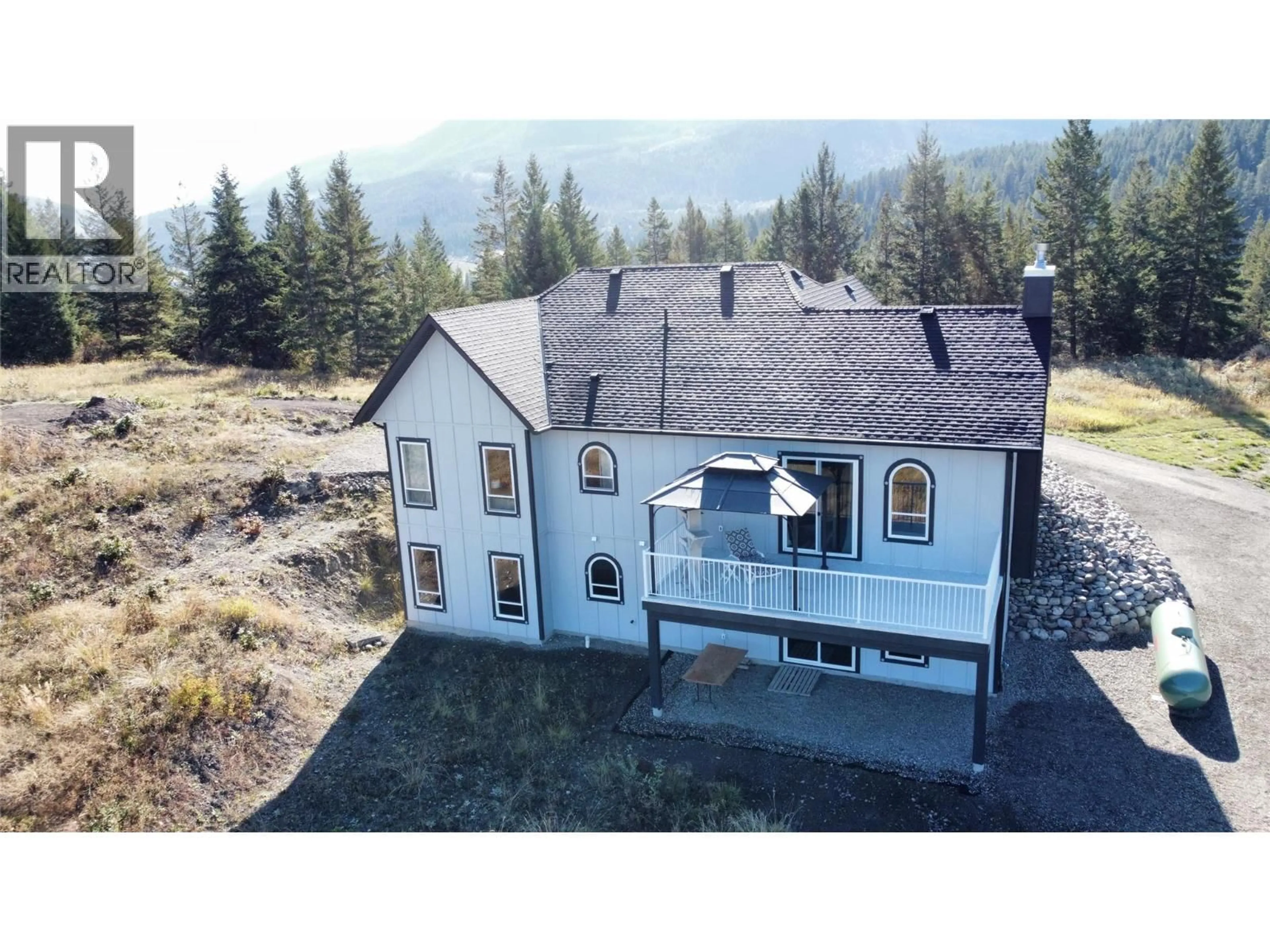 A pic from outside/outdoor area/front of a property/back of a property/a pic from drone, mountain view for 59 RAWLINGS LAKE ROAD, Lumby British Columbia V0E2G1