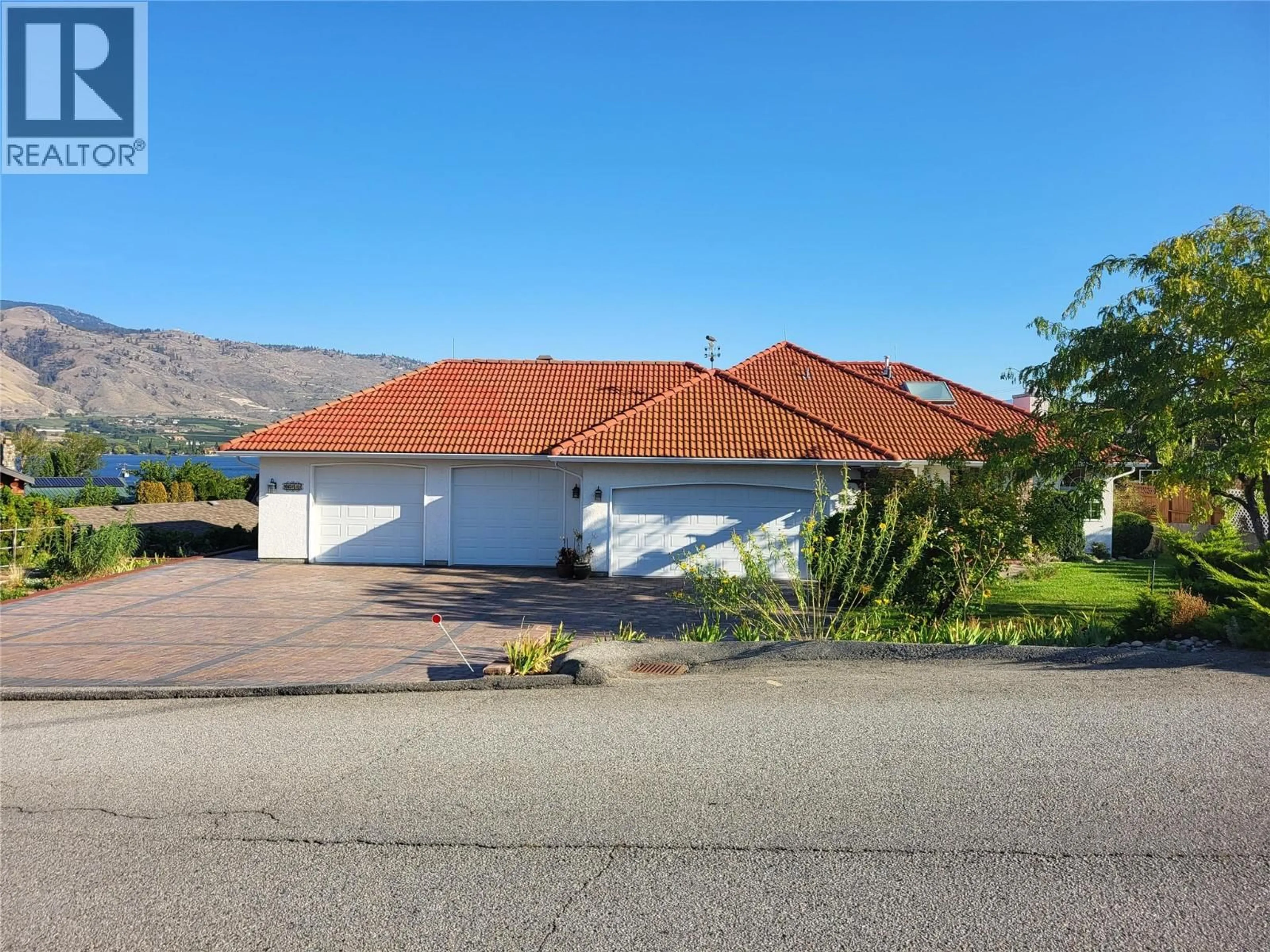A pic from outside/outdoor area/front of a property/back of a property/a pic from drone, street for 8311 92ND AVENUE, Osoyoos British Columbia V0H1V2