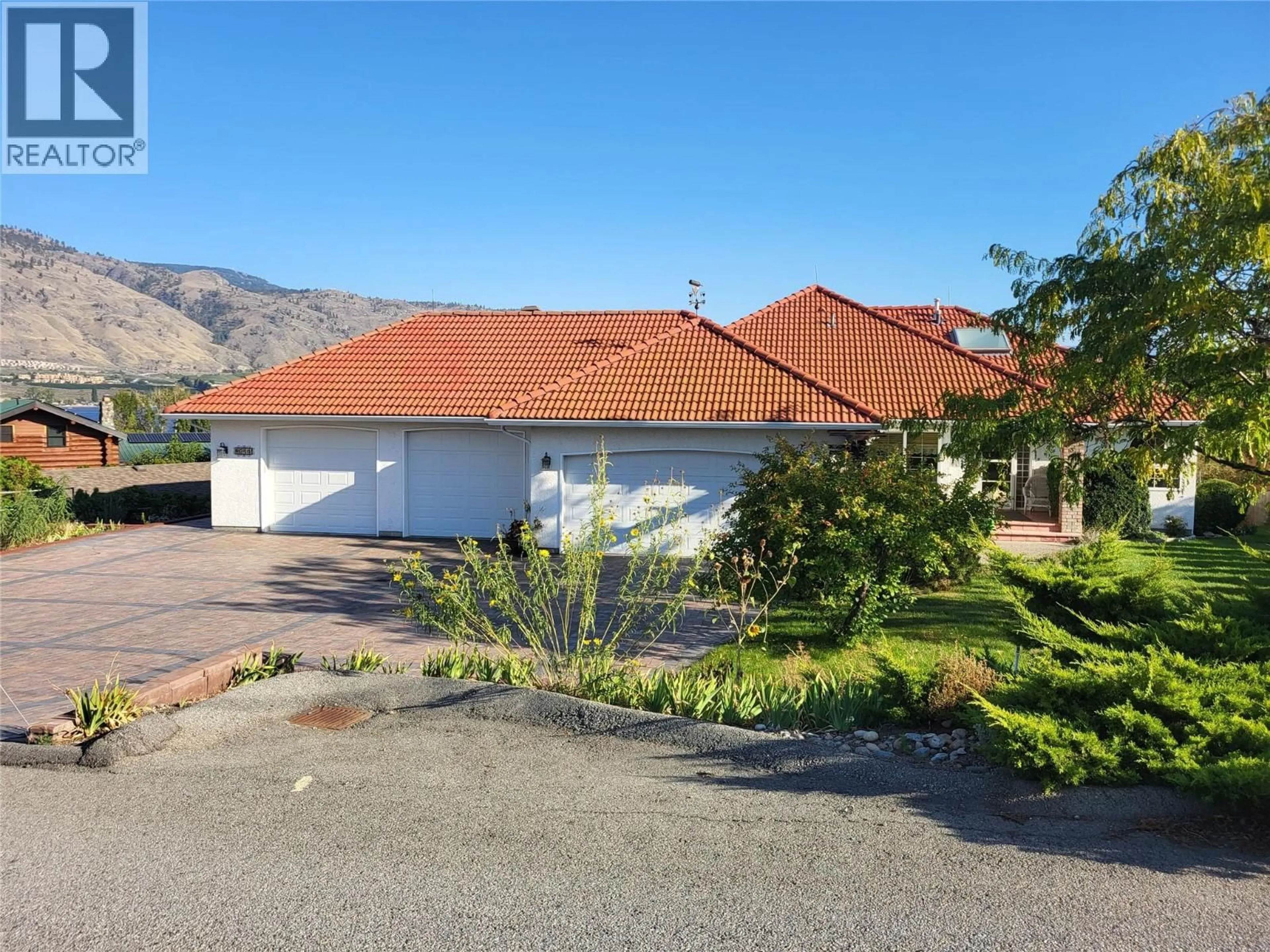 A pic from outside/outdoor area/front of a property/back of a property/a pic from drone, mountain view for 8311 92ND AVENUE, Osoyoos British Columbia V0H1V2