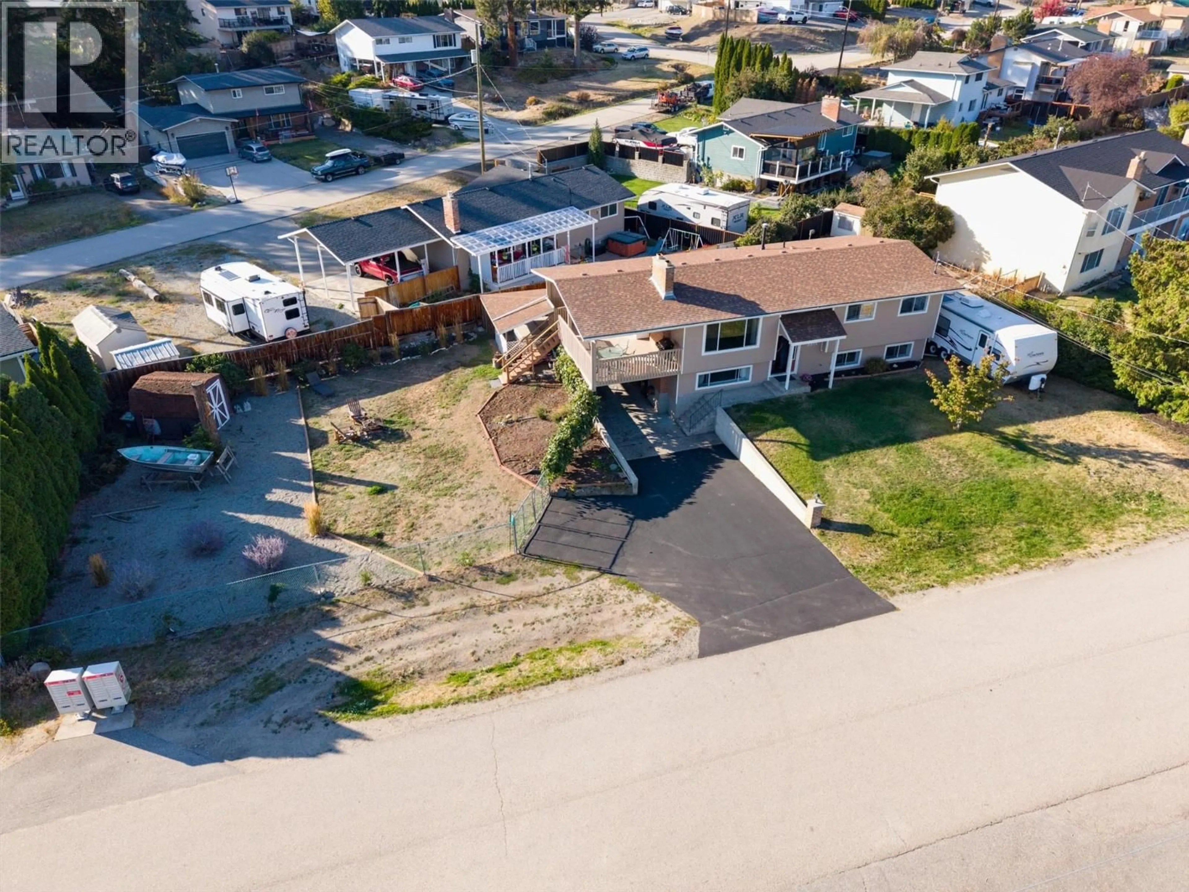 A pic from outside/outdoor area/front of a property/back of a property/a pic from drone, street for 3374 MCMURCHIE ROAD, West Kelowna British Columbia V4T1B4