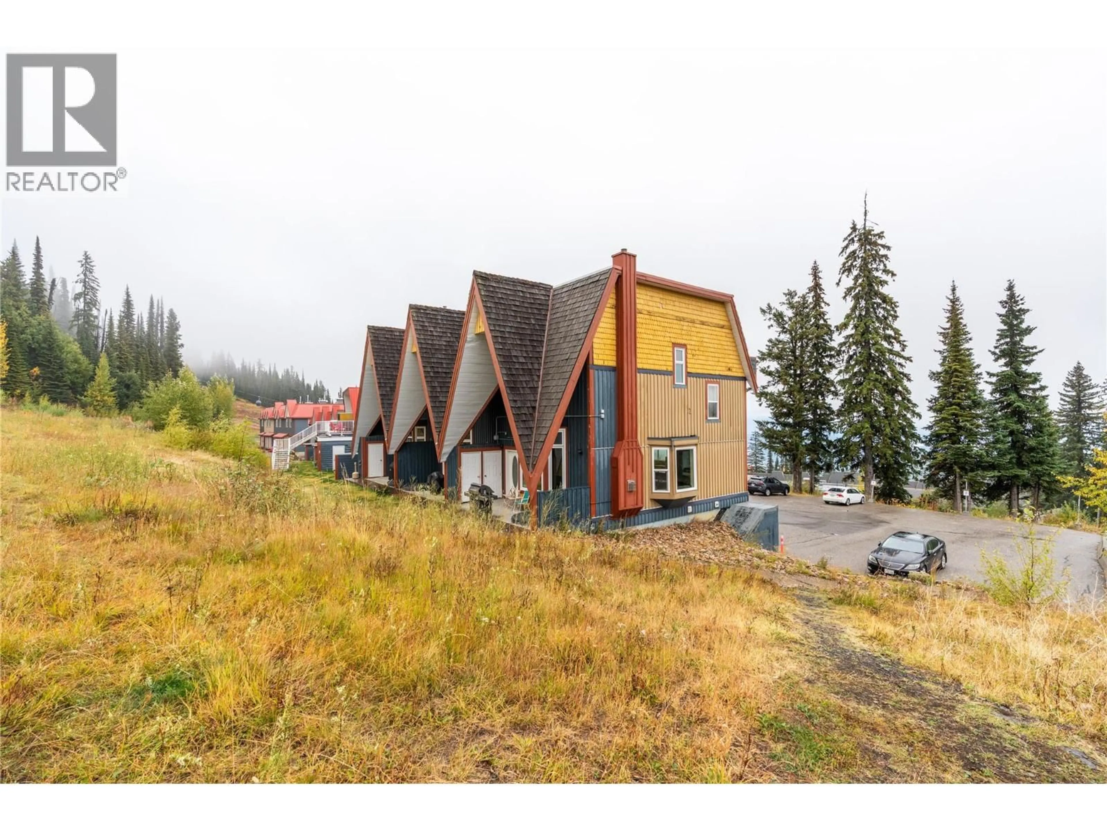 A pic from outside/outdoor area/front of a property/back of a property/a pic from drone, mountain view for 102 - 9885 PINNACLES ROAD, Silver Star British Columbia V1B3M1