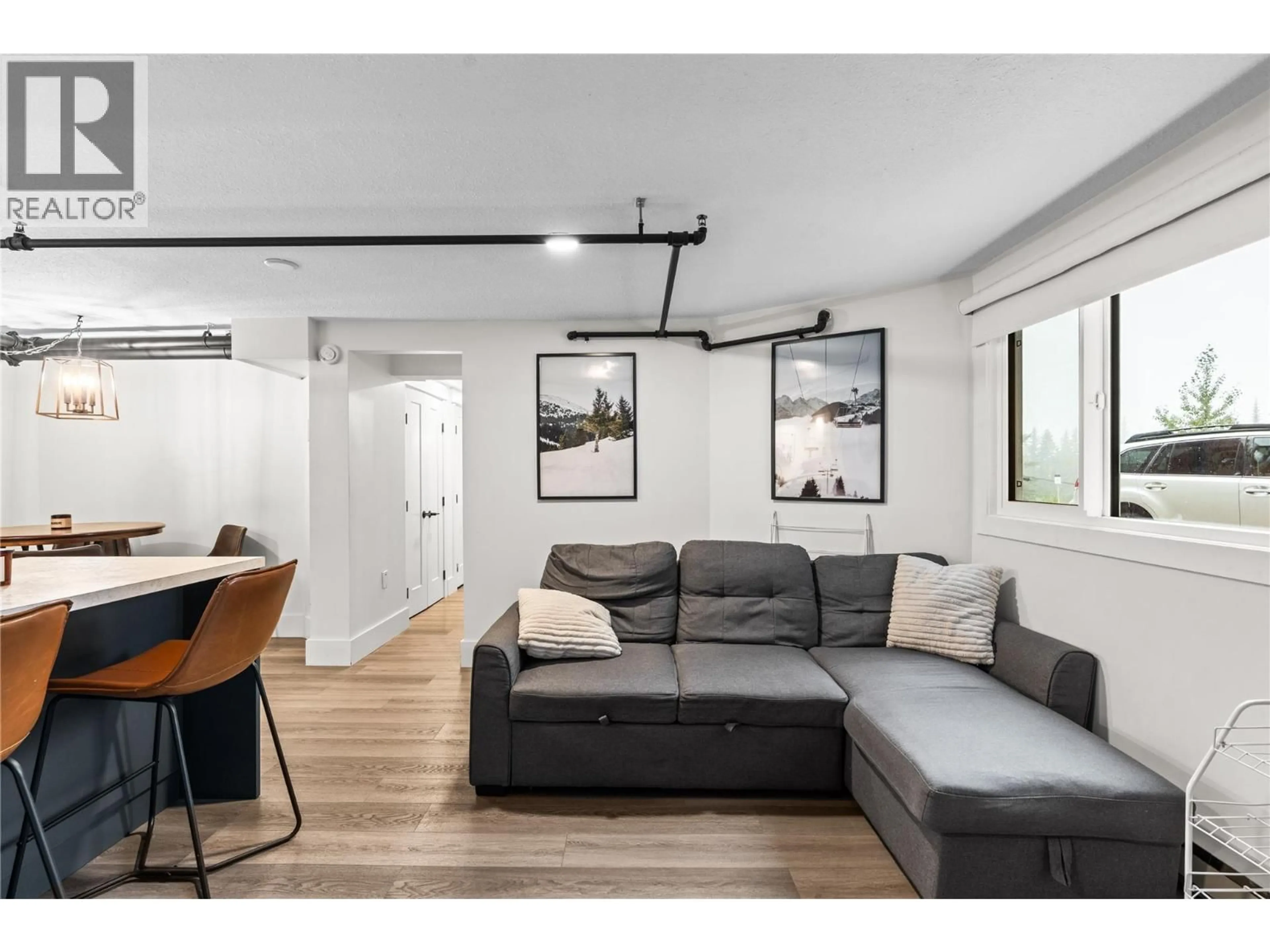 Living room with furniture, wood/laminate floor for 102 - 9885 PINNACLES ROAD, Silver Star British Columbia V1B3M1