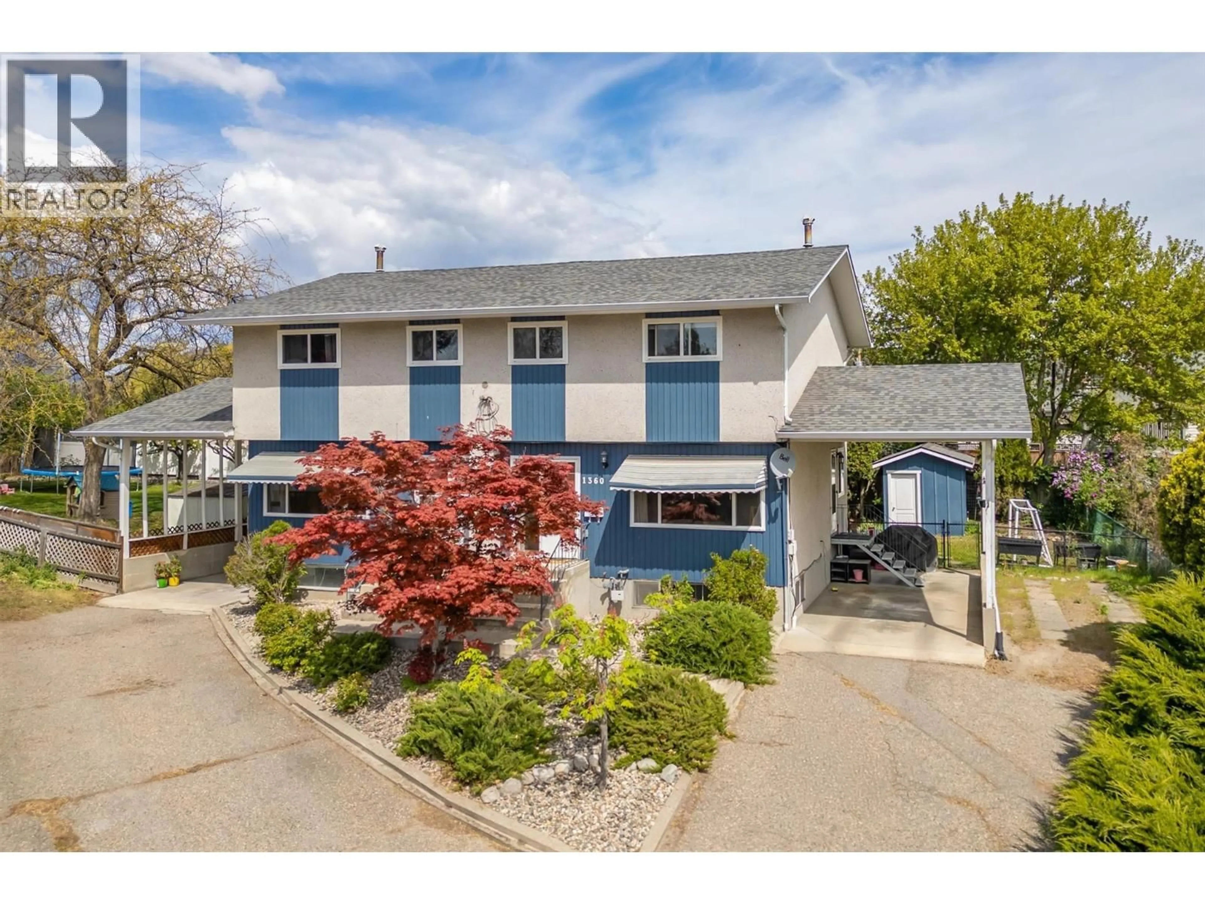 Home with vinyl exterior material, street for 1360 ELM STREET, Kelowna British Columbia V1Y3W6