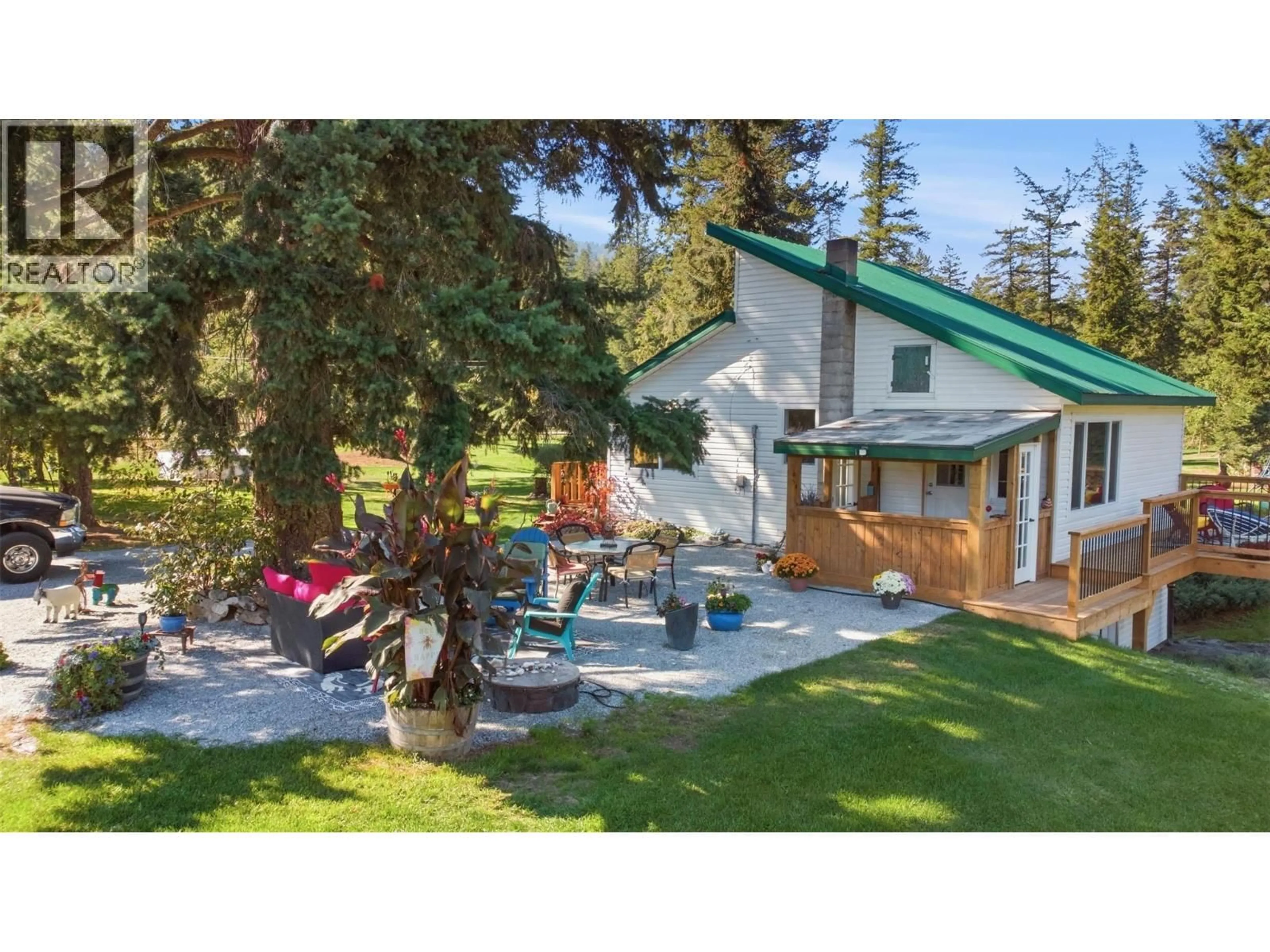 A pic from outside/outdoor area/front of a property/back of a property/a pic from drone, mountain view for 1385 6 HIGHWAY, Cherryville British Columbia V0E2G1