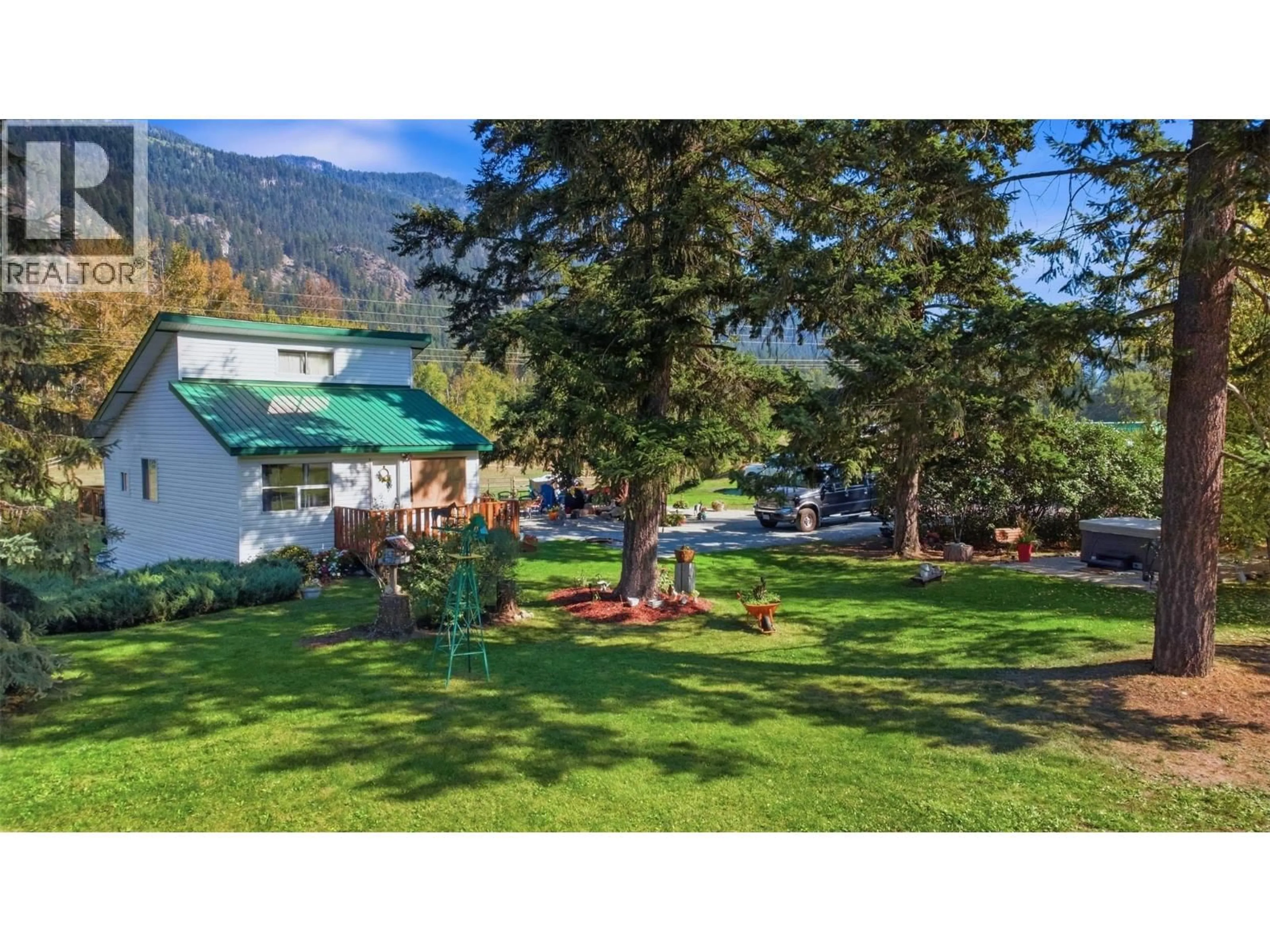 A pic from outside/outdoor area/front of a property/back of a property/a pic from drone, mountain view for 1385 6 HIGHWAY, Cherryville British Columbia V0E2G1