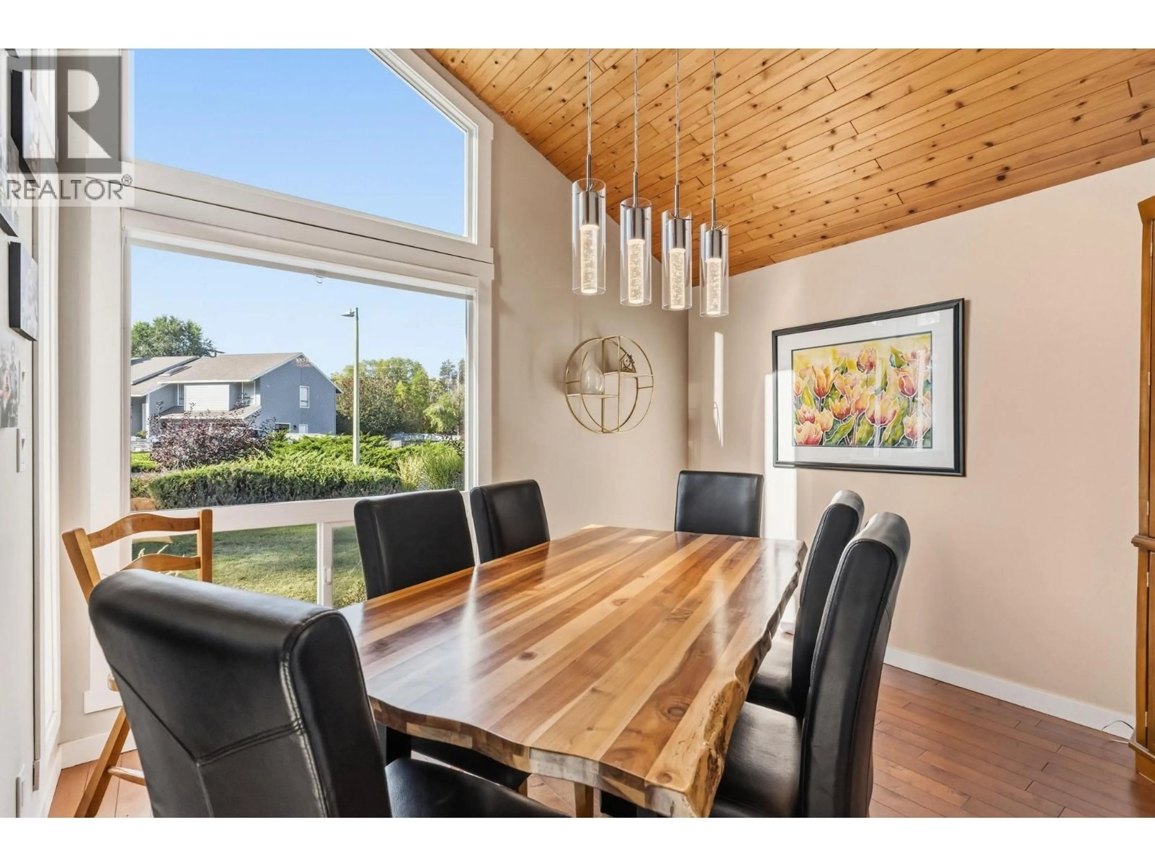 Dining room, wood/laminate floor for 710 TOZER COURT, Kelowna British Columbia V1W2P8
