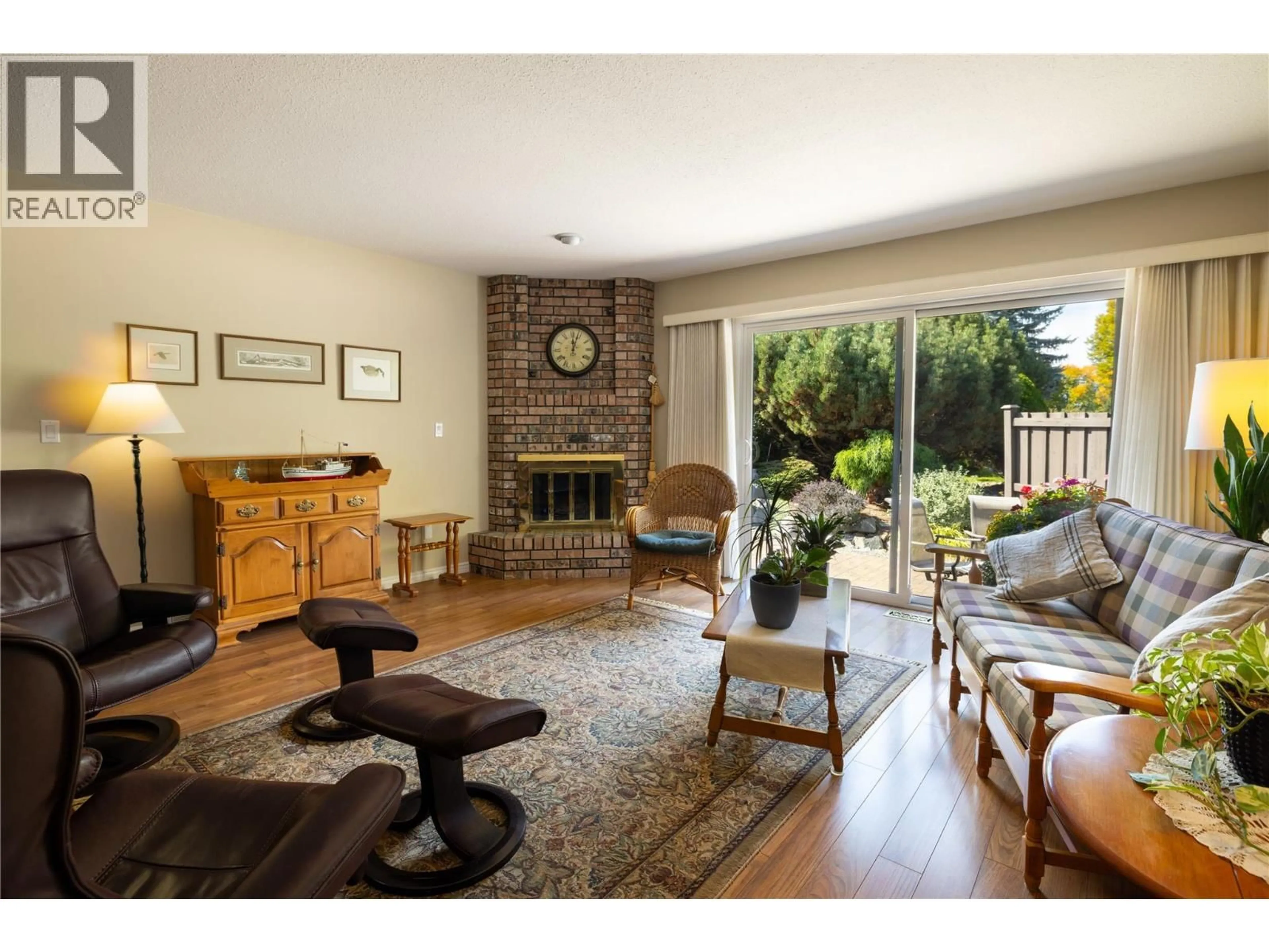 Living room with furniture, wood/laminate floor for 170 - 1995 BURTCH ROAD, Kelowna British Columbia V1Y4B4