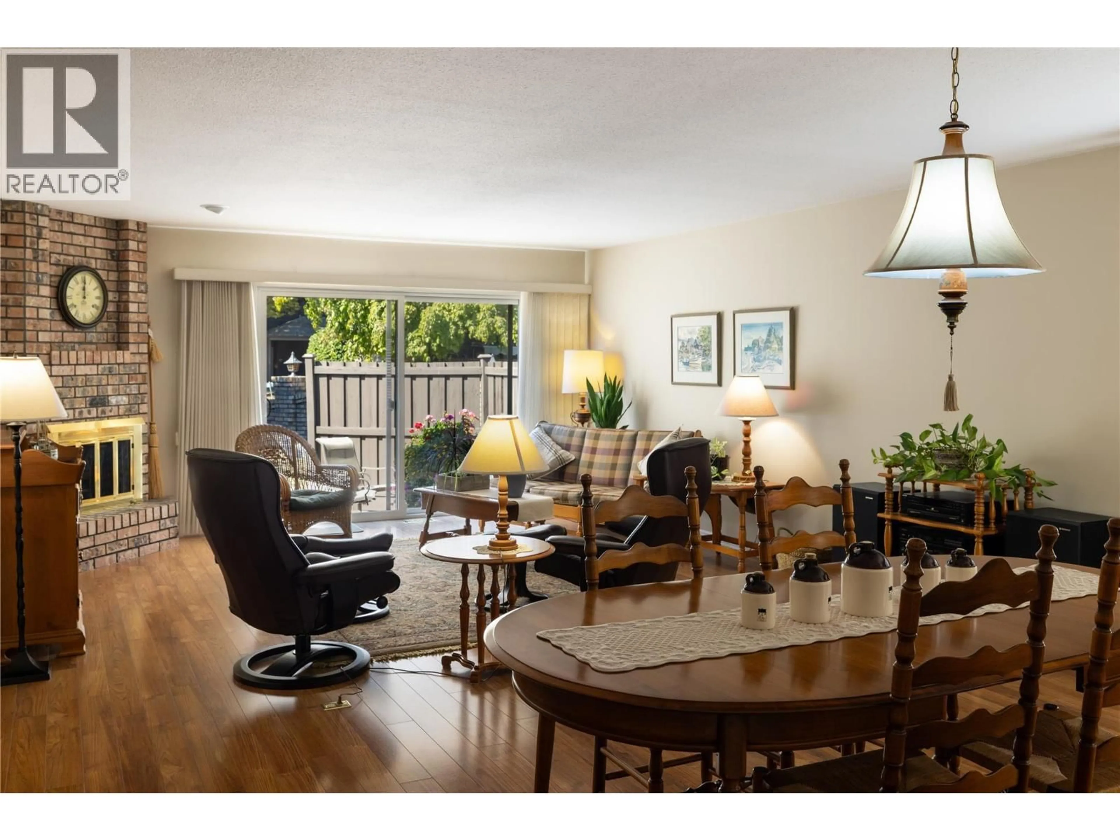 Living room with furniture, wood/laminate floor for 170 - 1995 BURTCH ROAD, Kelowna British Columbia V1Y4B4