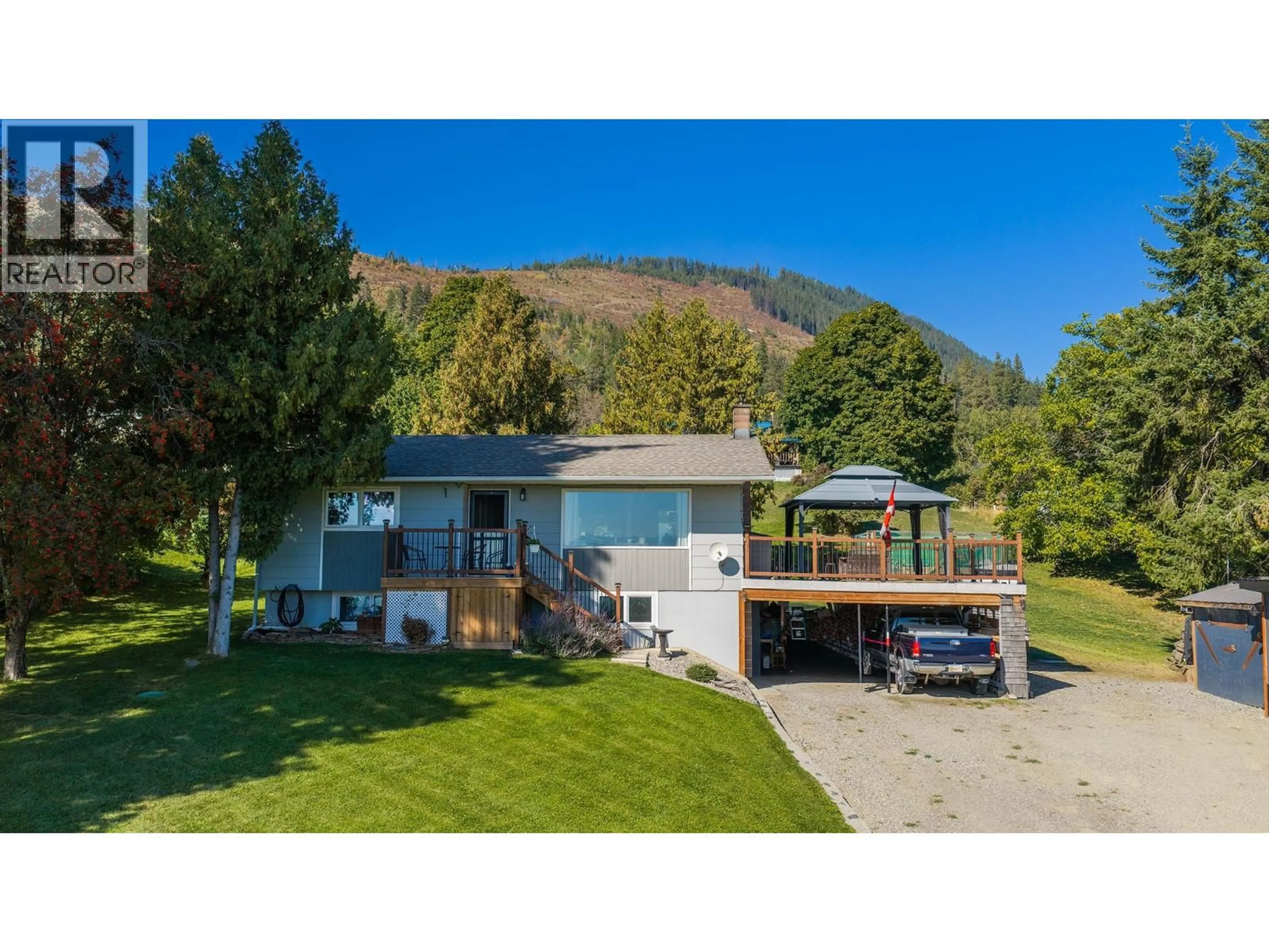 A pic from outside/outdoor area/front of a property/back of a property/a pic from drone, mountain view for 960 MONROSE ROAD, Wynndel British Columbia V0B2N2