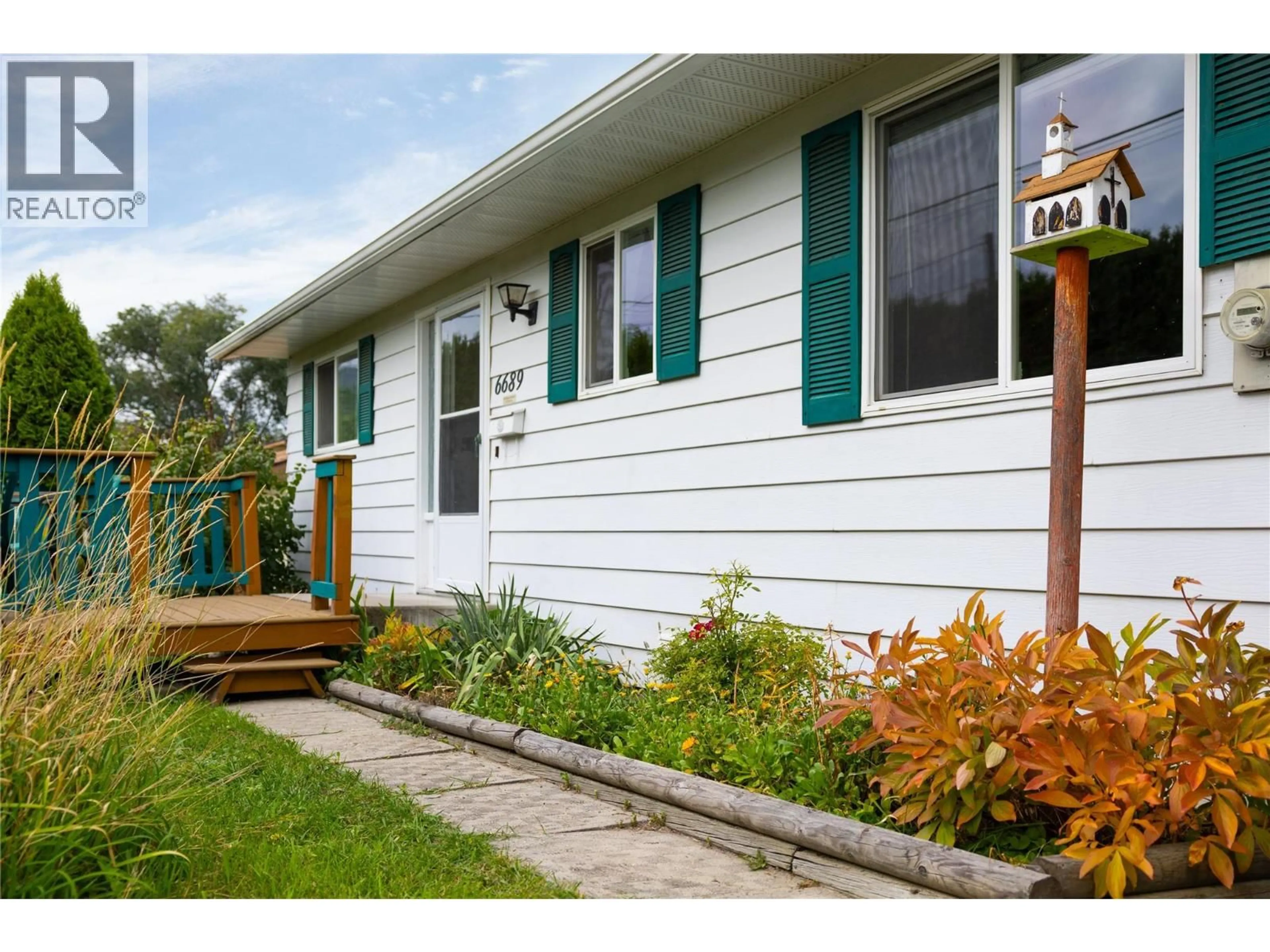 Home with vinyl exterior material, street for 6689 APOLLO ROAD, Vernon British Columbia V1H1J3