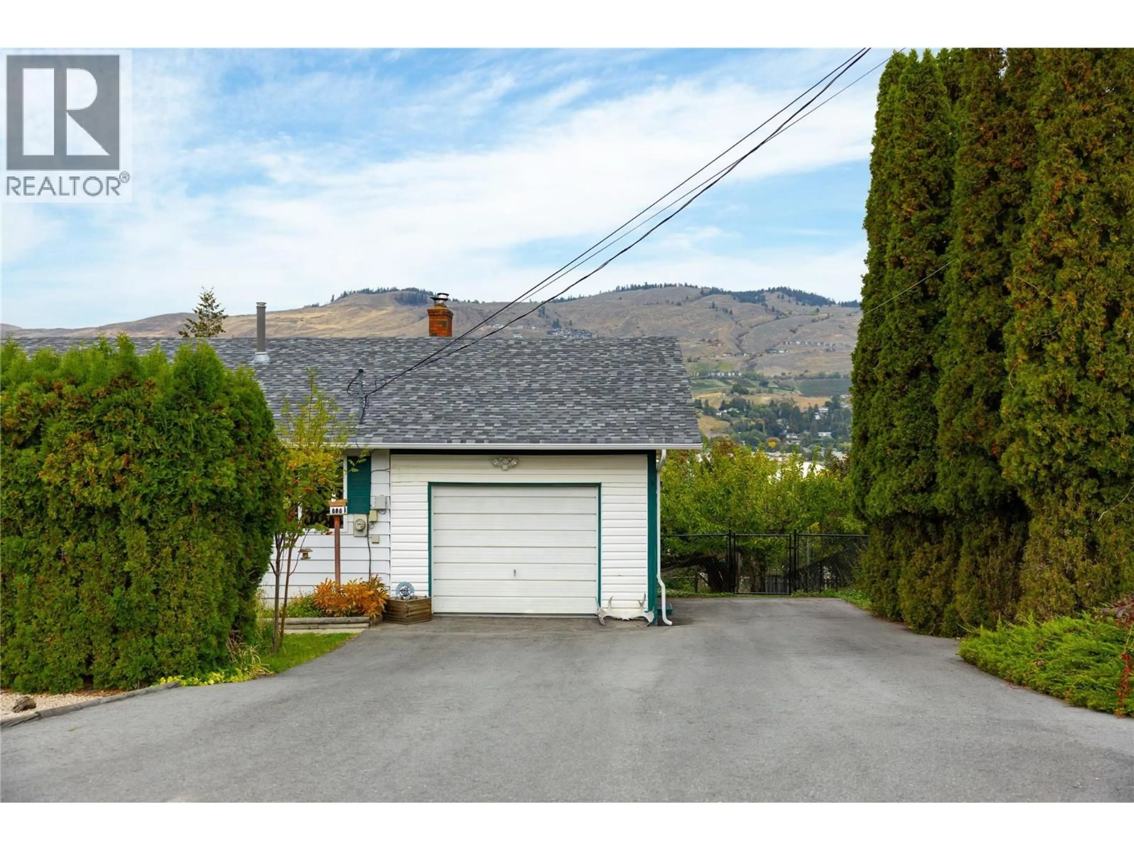 A pic from outside/outdoor area/front of a property/back of a property/a pic from drone, street for 6689 APOLLO ROAD, Vernon British Columbia V1H1J3