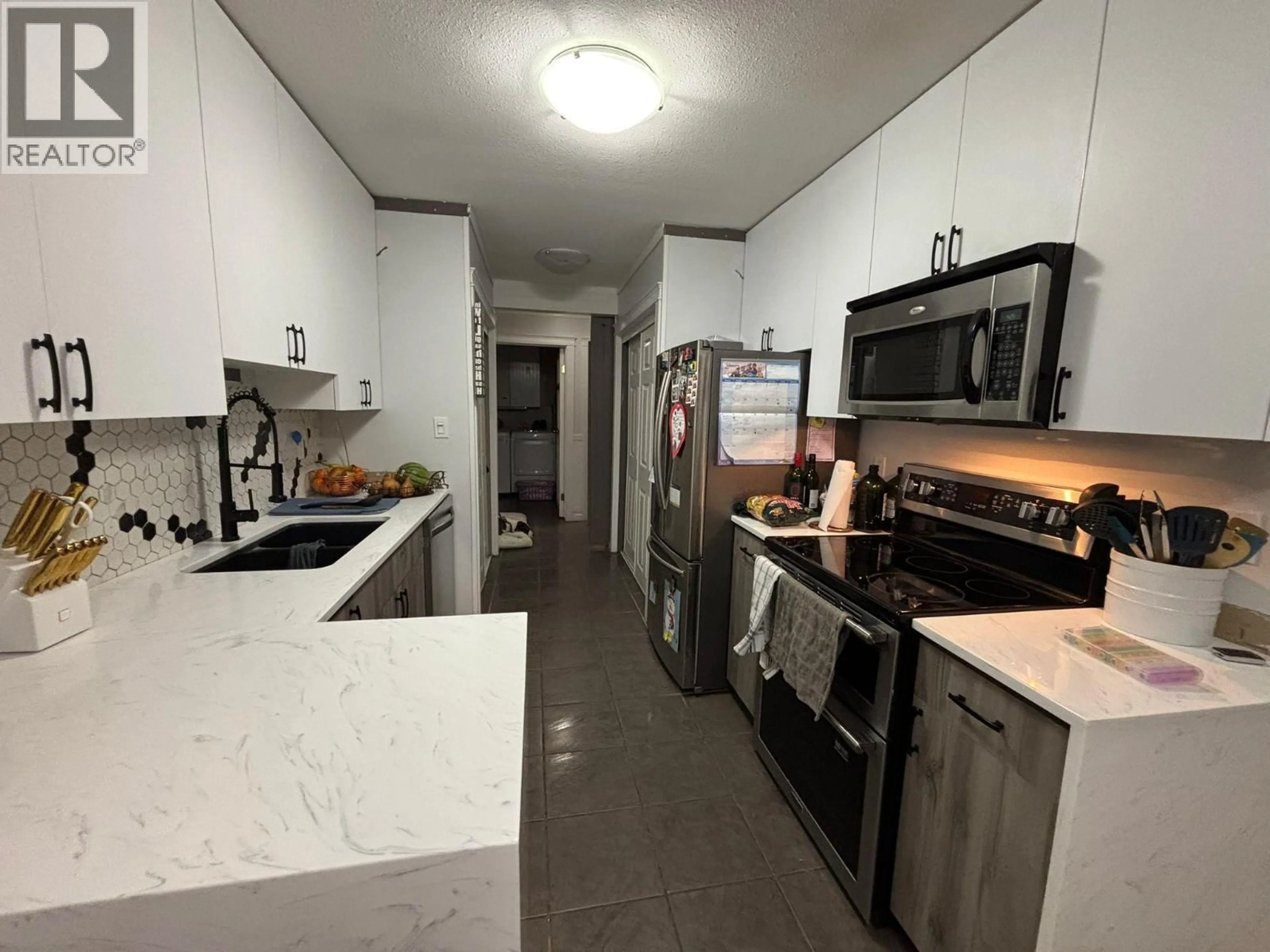Standard kitchen, ceramic/tile floor for 190 - 3854 GORDON DRIVE, Kelowna British Columbia V1W3G4