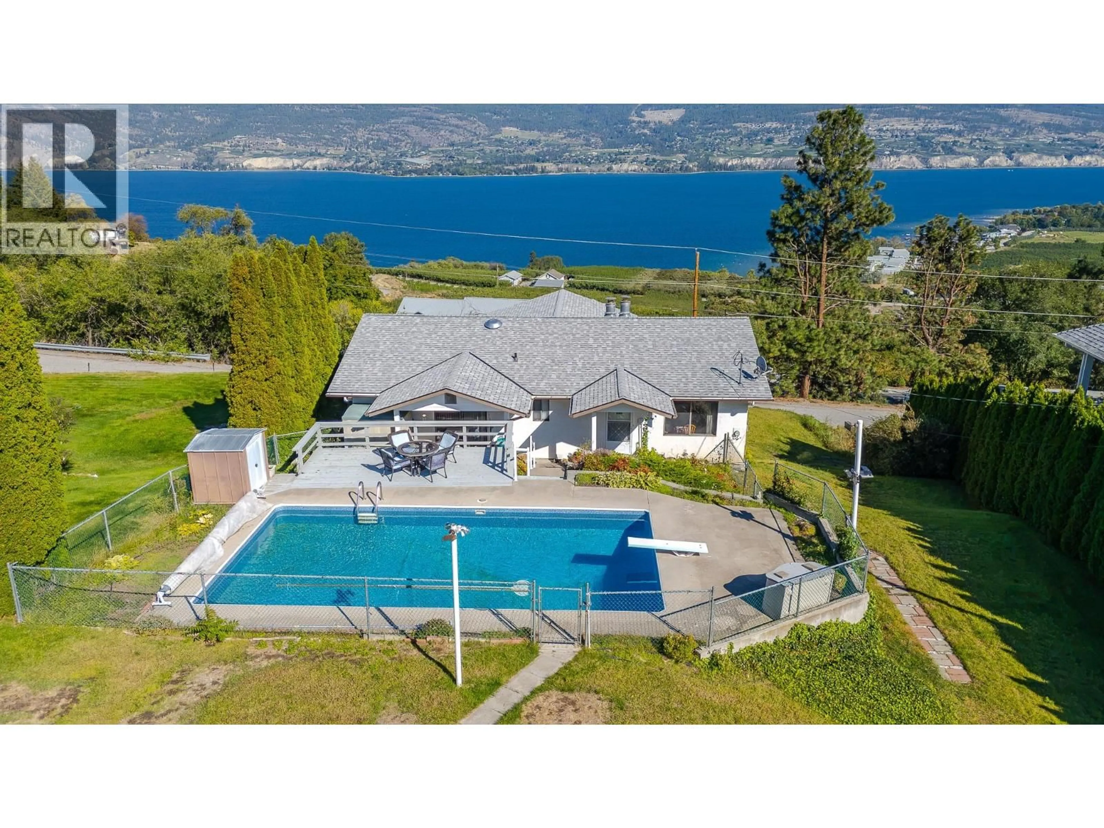 A pic from outside/outdoor area/front of a property/back of a property/a pic from drone, water/lake/river/ocean view for 8820 HAPPY VALLEY ROAD, Summerland British Columbia V0H1Z7