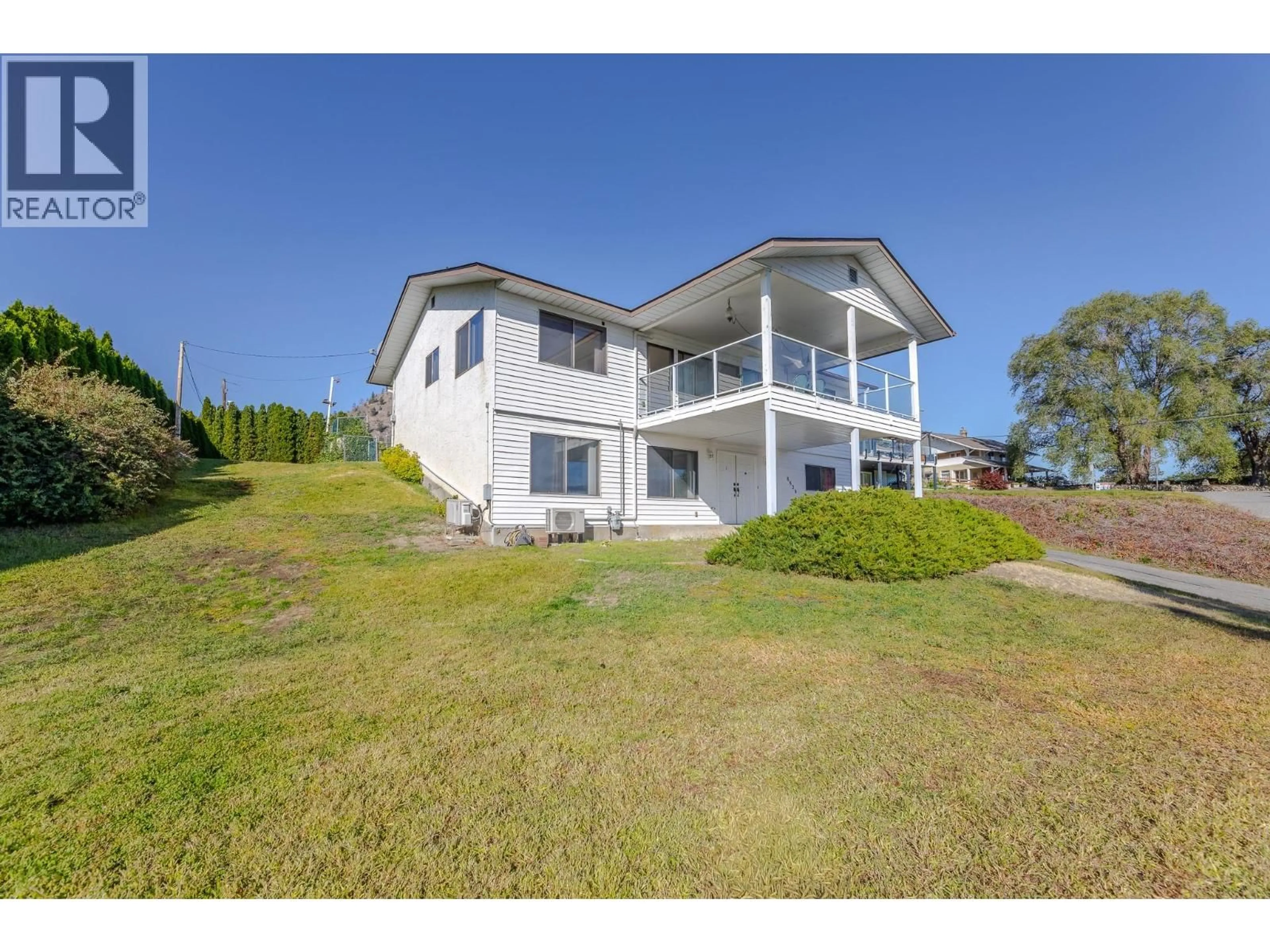 A pic from outside/outdoor area/front of a property/back of a property/a pic from drone, water/lake/river/ocean view for 8820 HAPPY VALLEY ROAD, Summerland British Columbia V0H1Z7