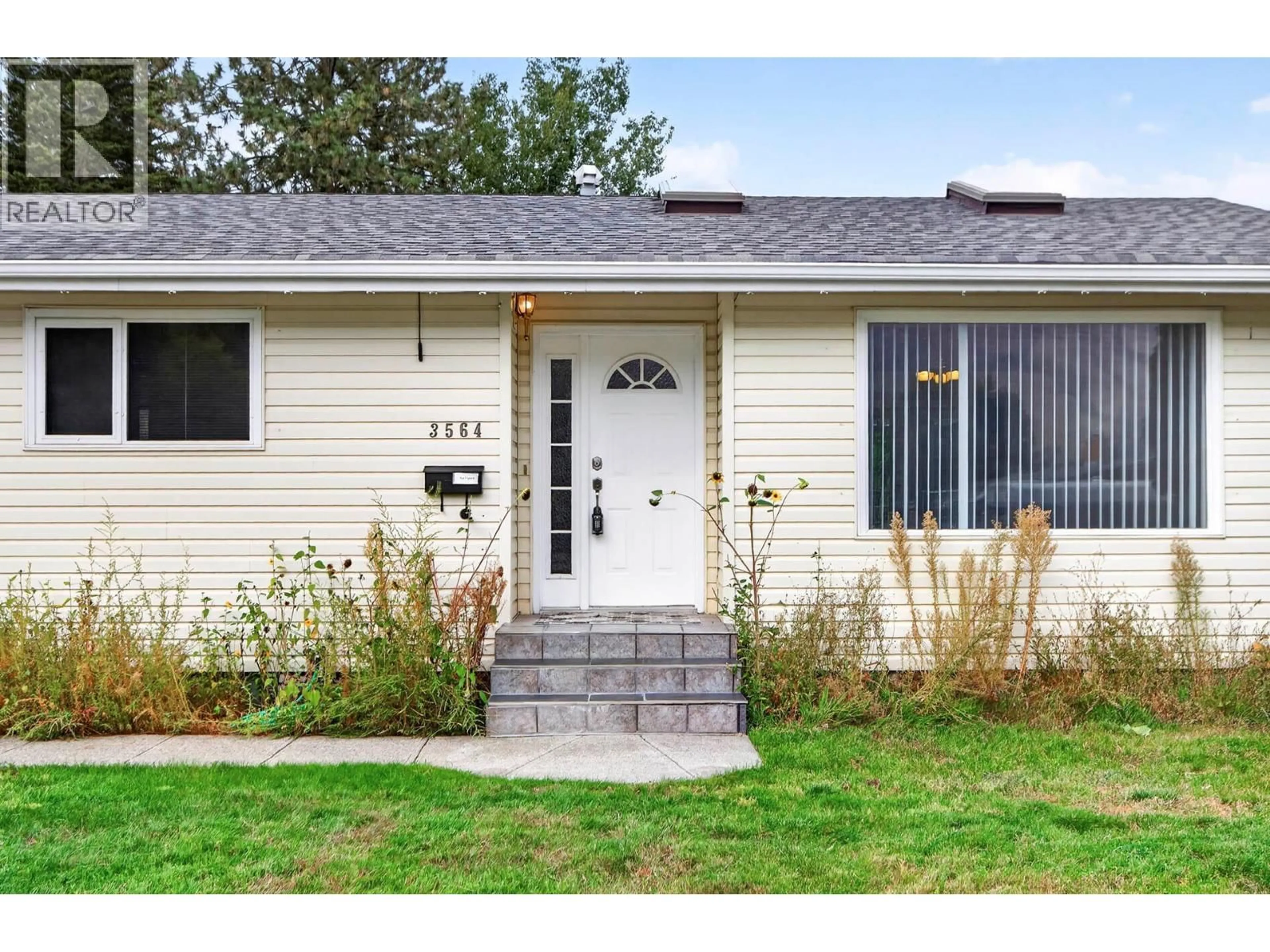 Home with vinyl exterior material, street for 3564 BANK ROAD, Kamloops British Columbia V2B7A6