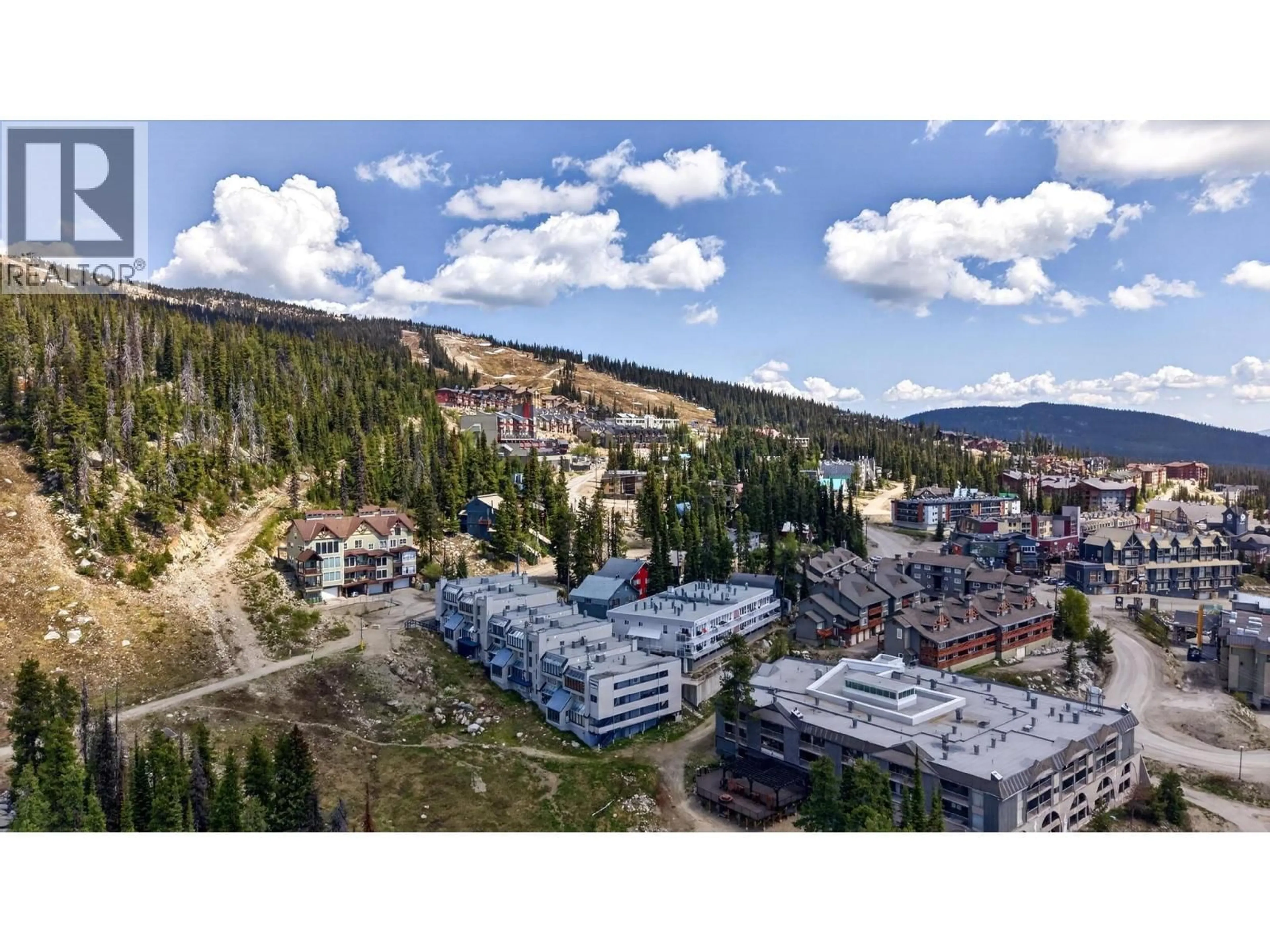 A pic from outside/outdoor area/front of a property/back of a property/a pic from drone, mountain view for B6 - 7375 PORCUPINE ROAD, Big White British Columbia V1P1P3