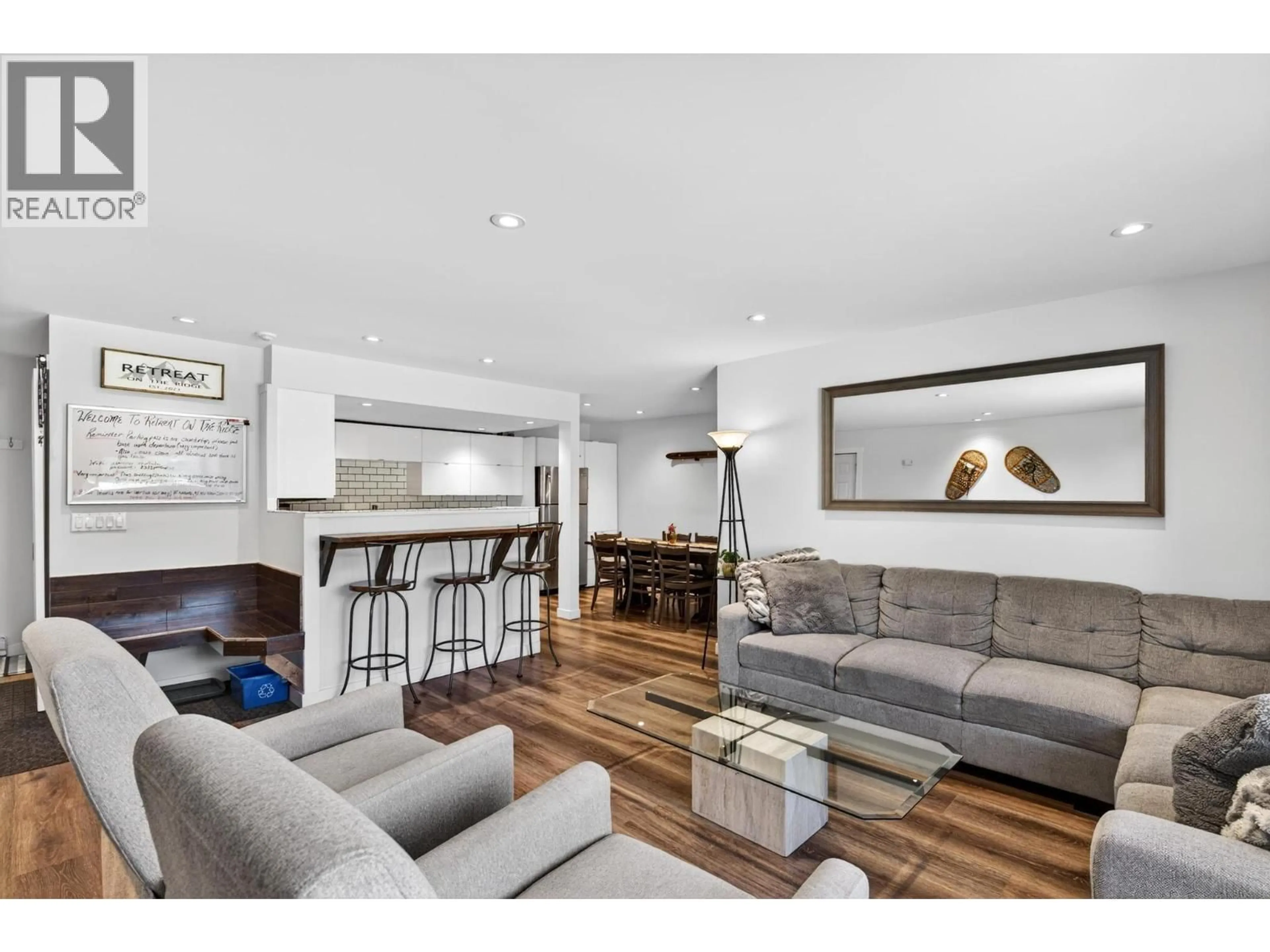 Living room with furniture, wood/laminate floor for B6 - 7375 PORCUPINE ROAD, Big White British Columbia V1P1P3