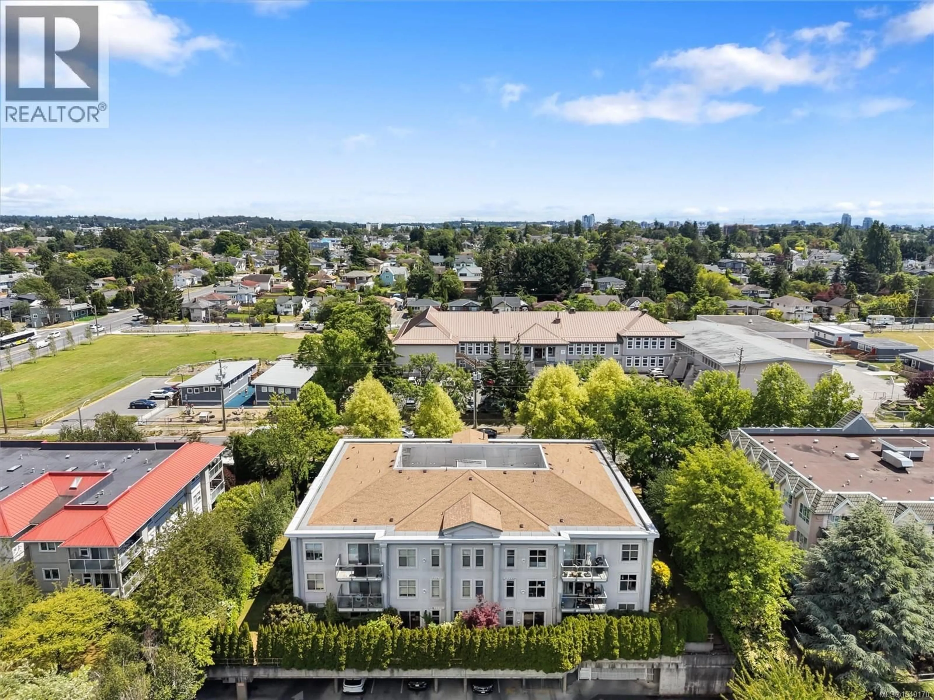 A pic from outside/outdoor area/front of a property/back of a property/a pic from drone, city buildings view from balcony for 407 - 3160 ALBINA STREET, Saanich British Columbia V9A1Z5