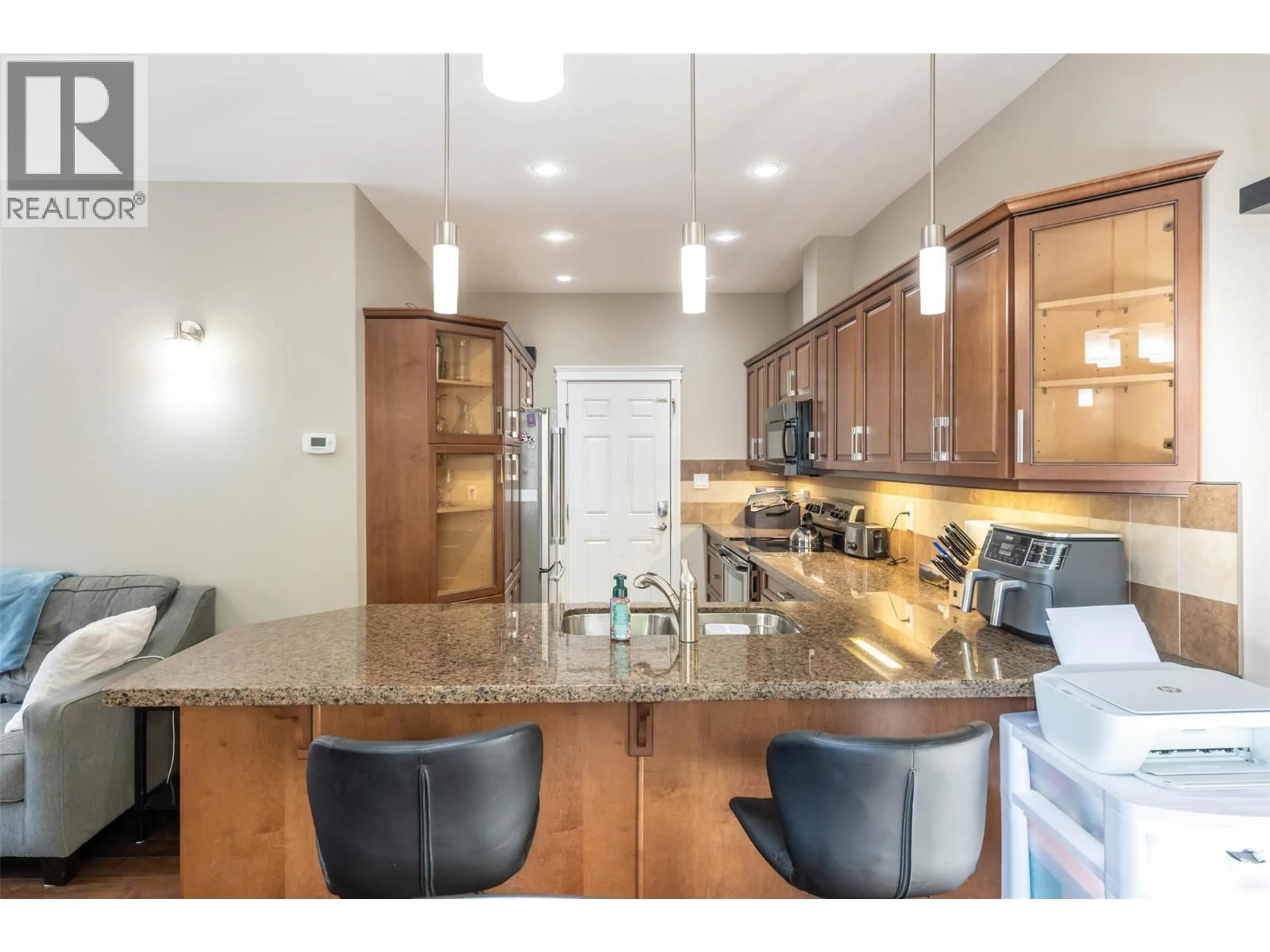 Open concept kitchen, ceramic/tile floor for 104 - 296 KINNEY AVENUE, Penticton British Columbia V2A3N9