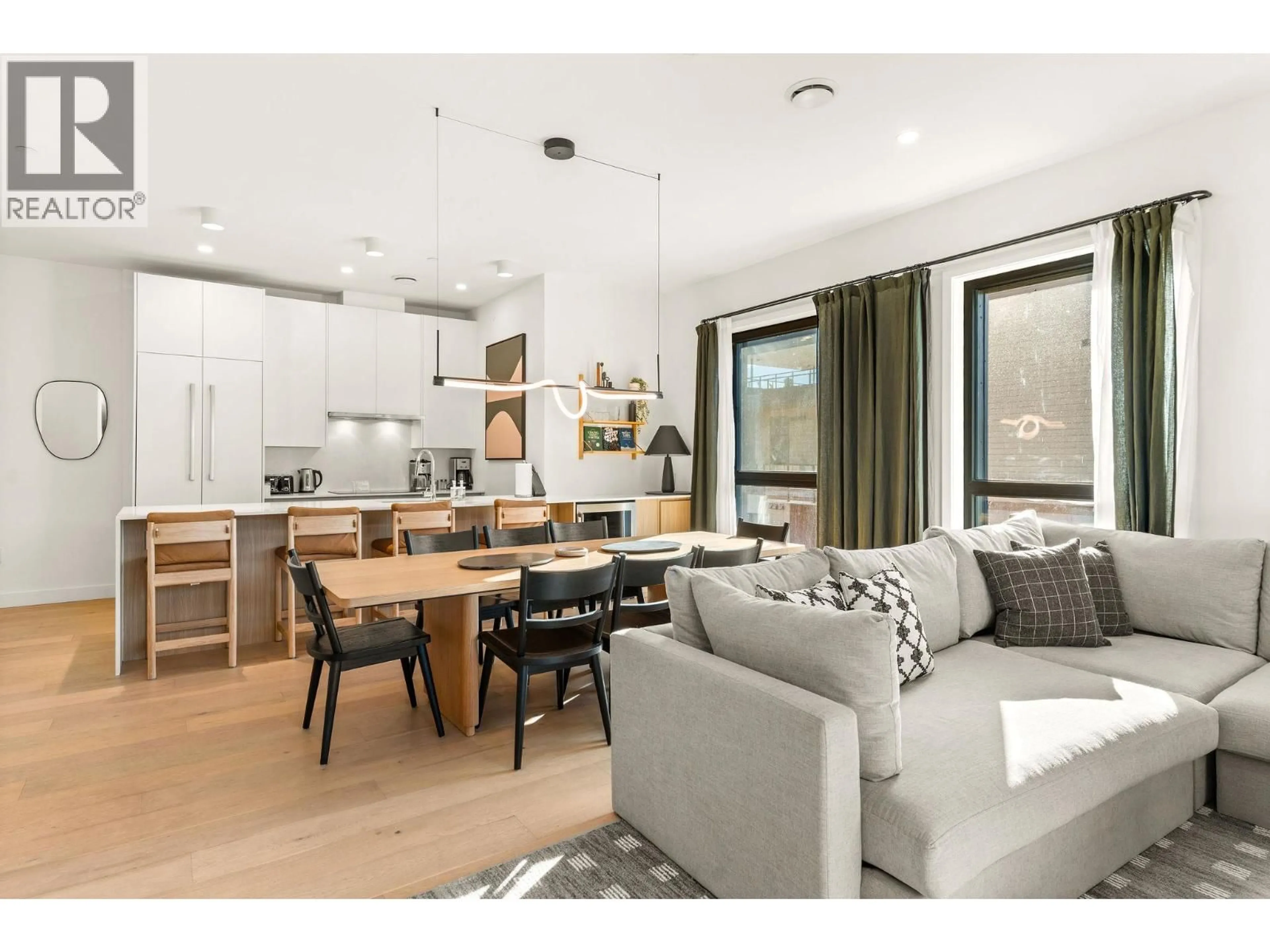 Open concept kitchen, wood/laminate floor for 2501 - 1702 COURSIER AVENUE, Revelstoke British Columbia V0E2S1