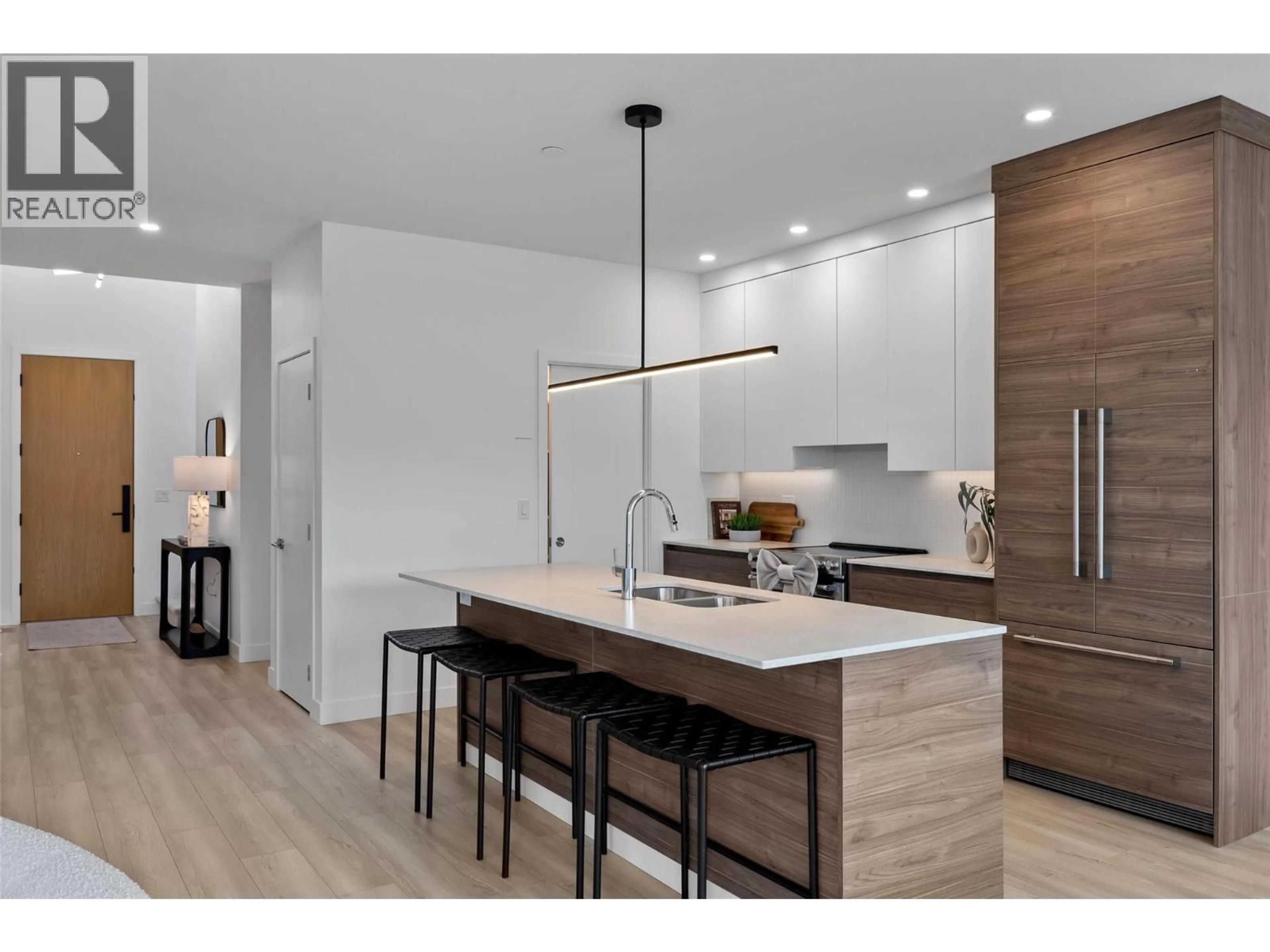 Open concept kitchen, wood/laminate floor for 5046 SUN RIVERS DRIVE, Kamloops British Columbia V2H0E7
