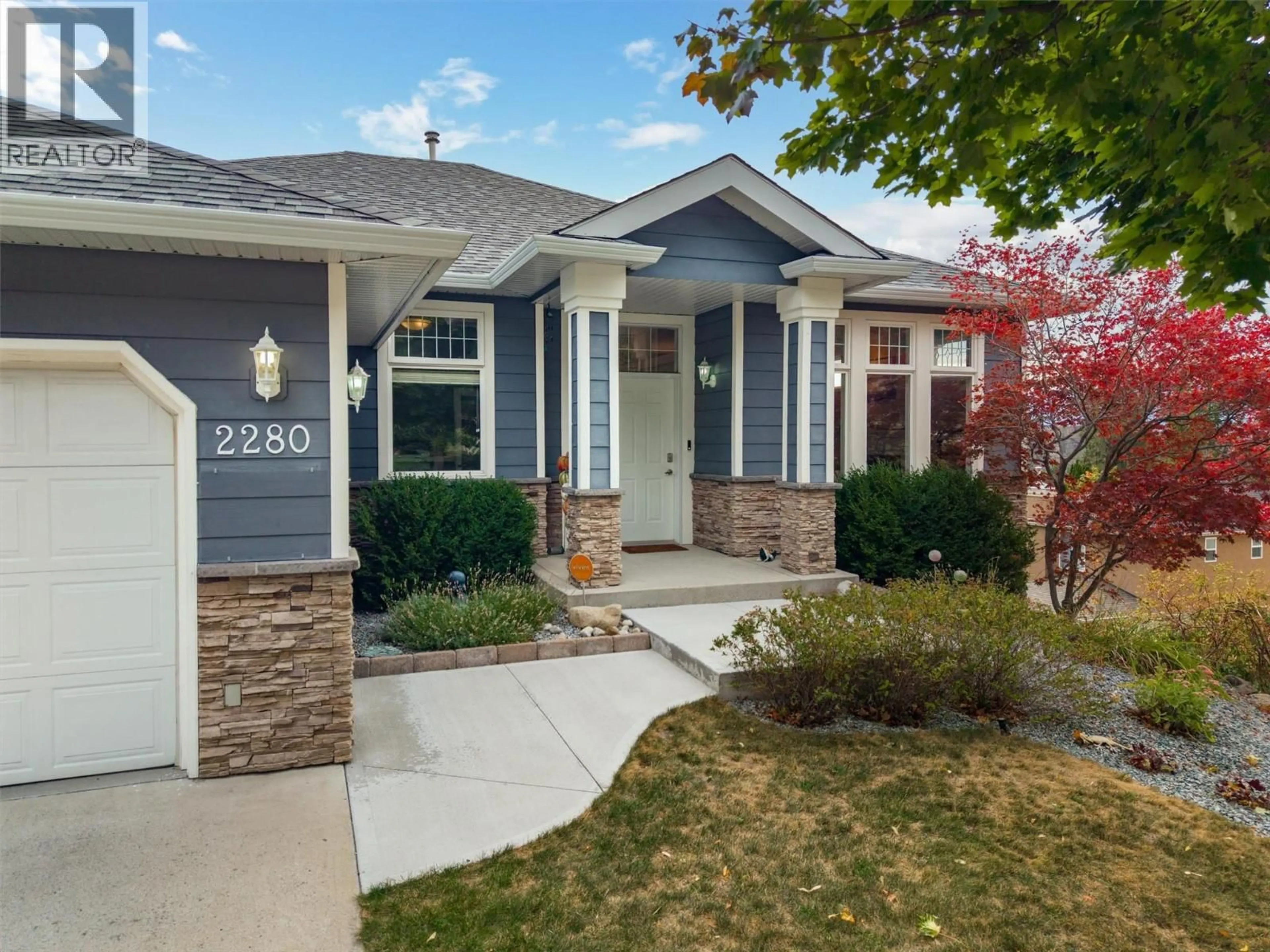 Home with vinyl exterior material, street for 2280 SHANNON HILLS DRIVE, West Kelowna British Columbia V4T2P1