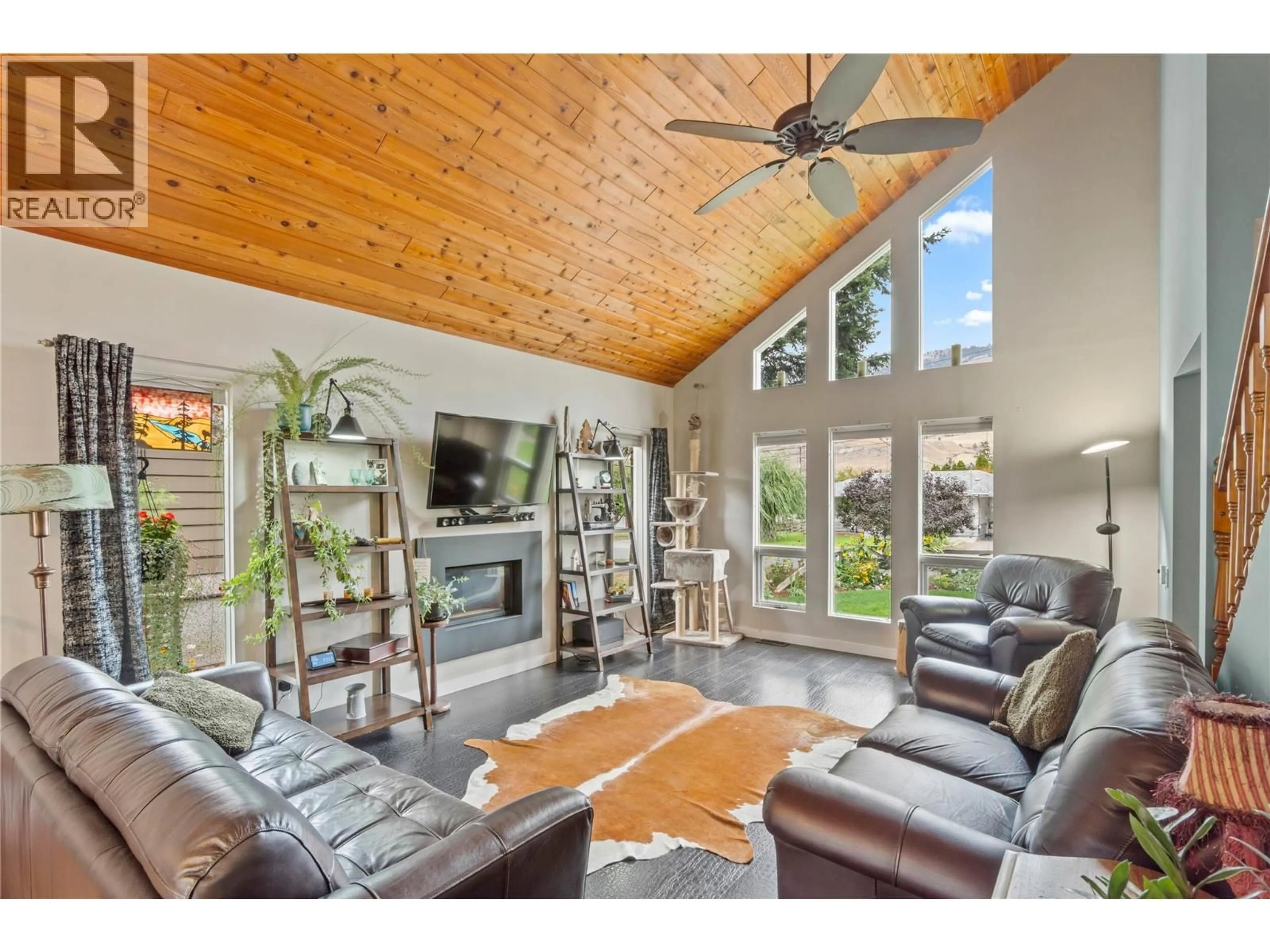 Living room with furniture, wood/laminate floor for 2653 SUNSET DRIVE, Kamloops British Columbia V2C4K4