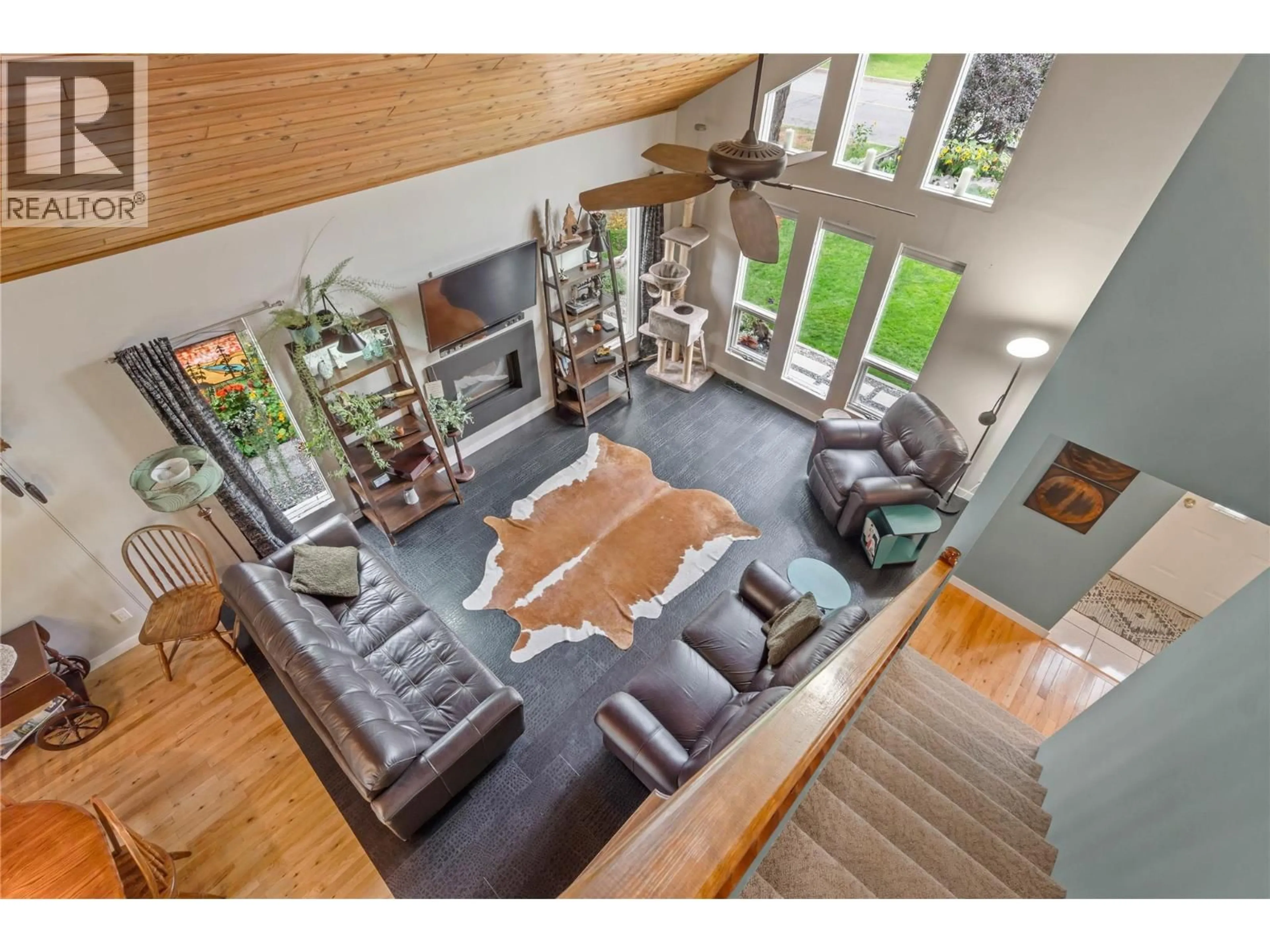 Living room with furniture, wood/laminate floor for 2653 SUNSET DRIVE, Kamloops British Columbia V2C4K4