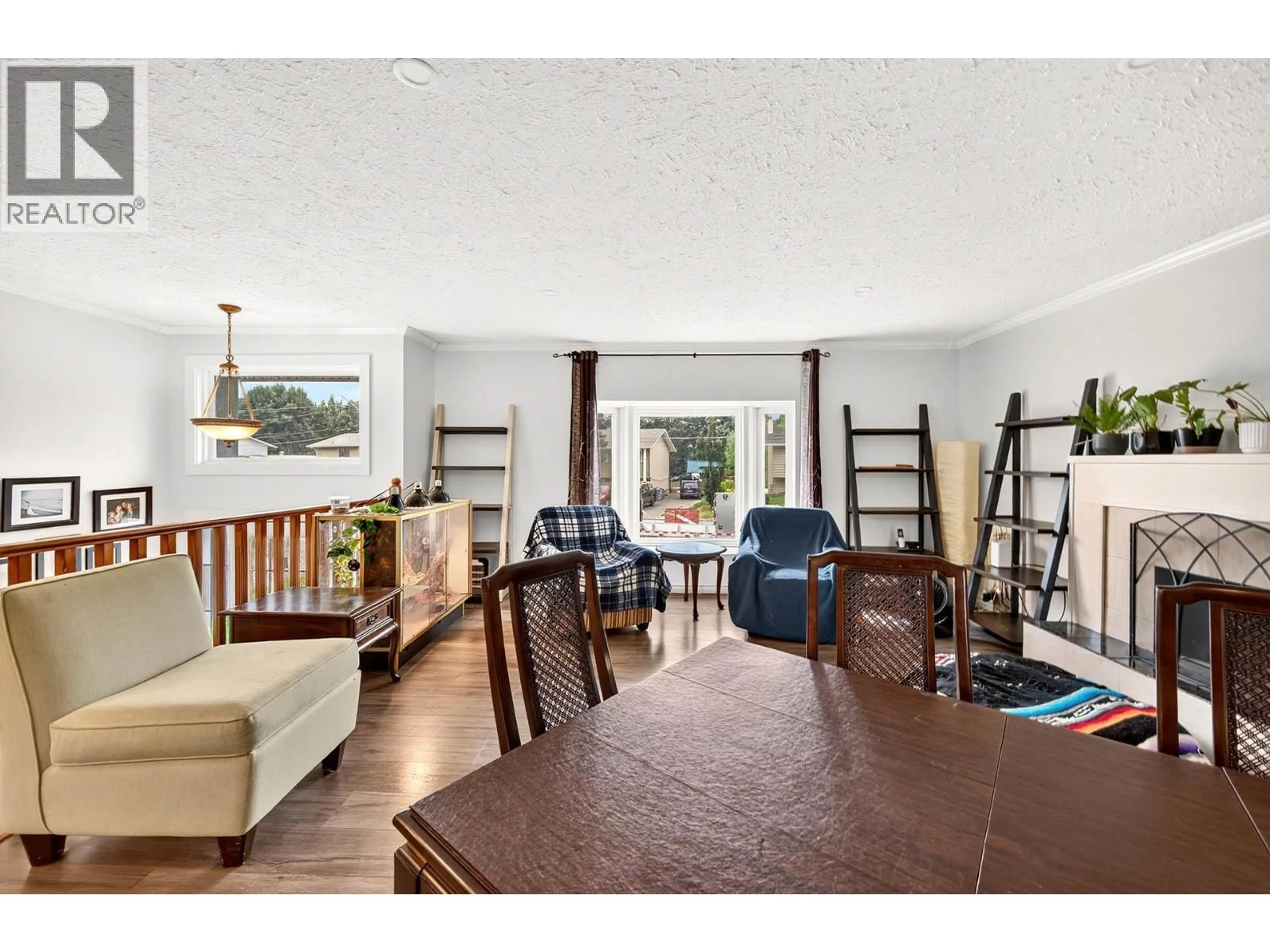 Living room with furniture, wood/laminate floor for 4634 STEVENS DRIVE, Kamloops British Columbia V2H1L5