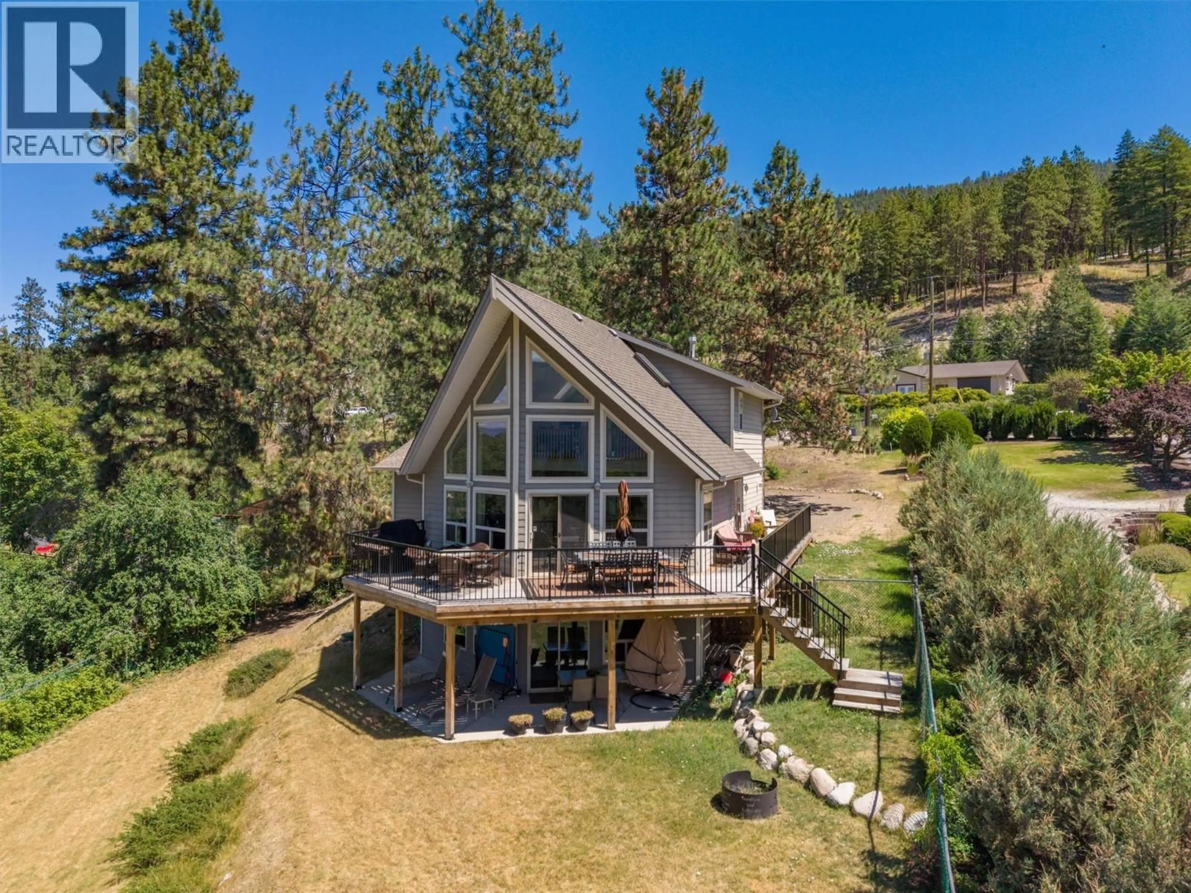 A pic from outside/outdoor area/front of a property/back of a property/a pic from drone, mountain view for 16490 COMMONAGE ROAD, Lake Country British Columbia V4V1B3