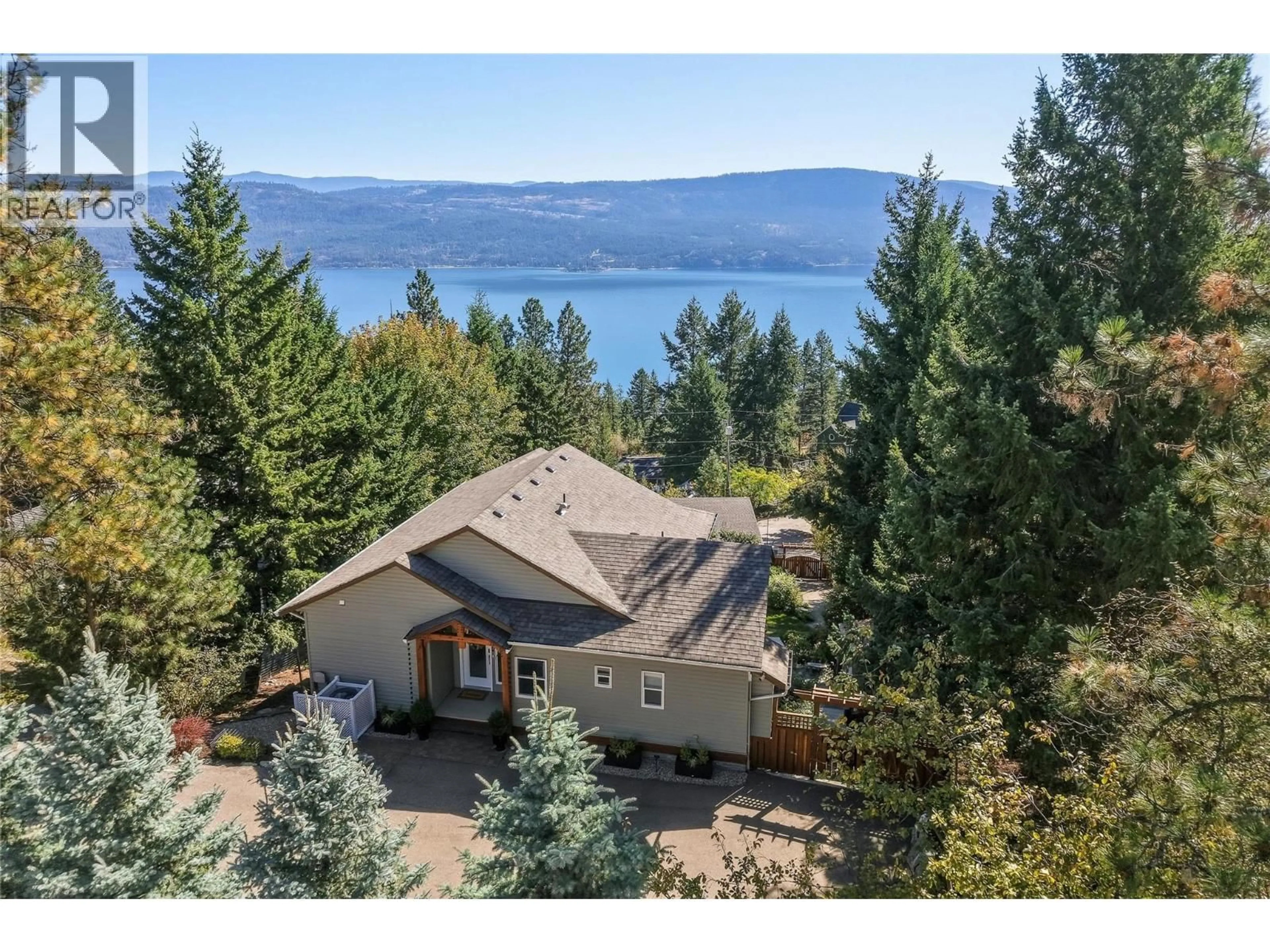 A pic from outside/outdoor area/front of a property/back of a property/a pic from drone, water/lake/river/ocean view for 642 MOUNTAIN DRIVE, Vernon British Columbia V1H2B7