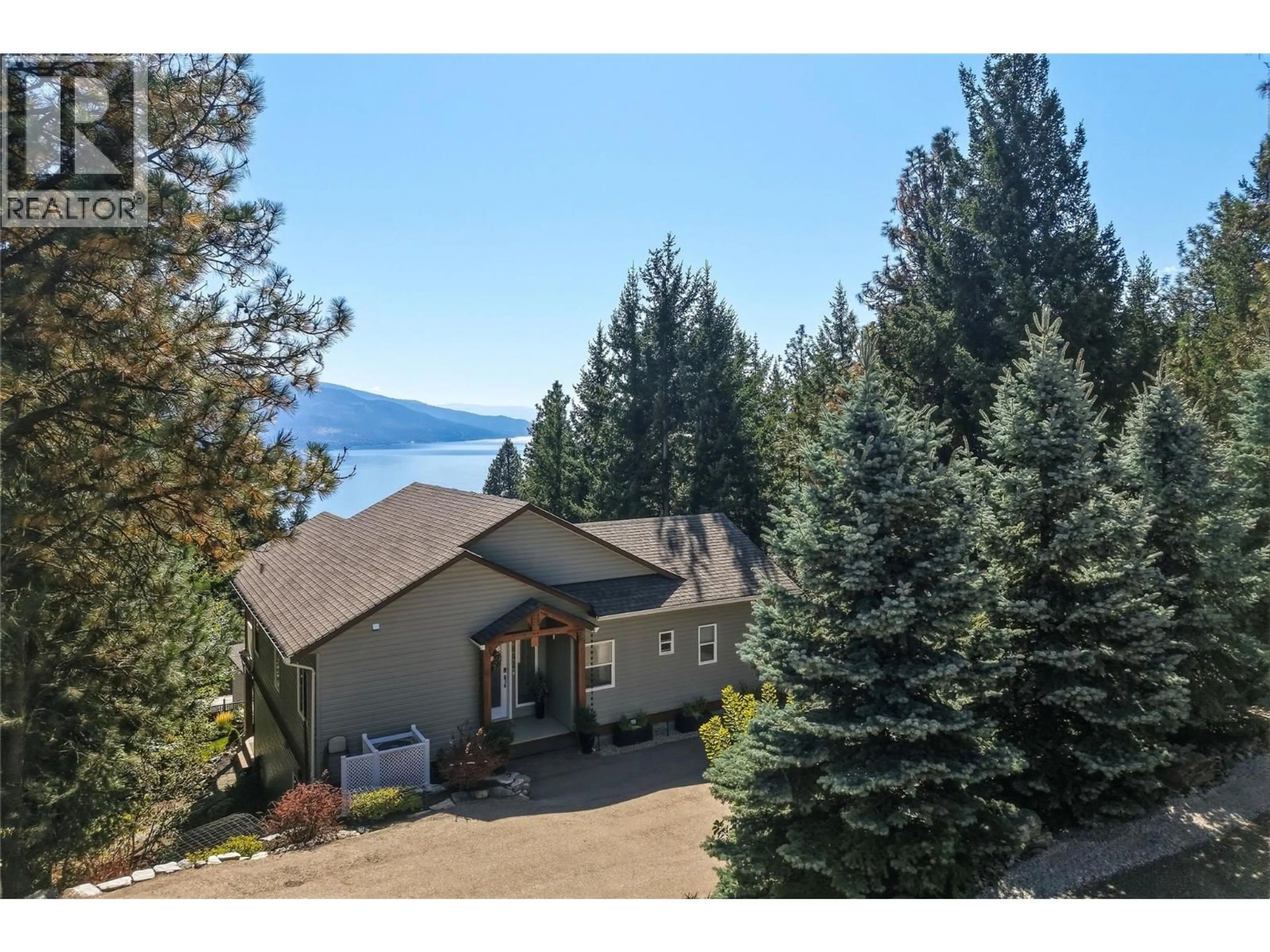 A pic from outside/outdoor area/front of a property/back of a property/a pic from drone, water/lake/river/ocean view for 642 MOUNTAIN DRIVE, Vernon British Columbia V1H2B7