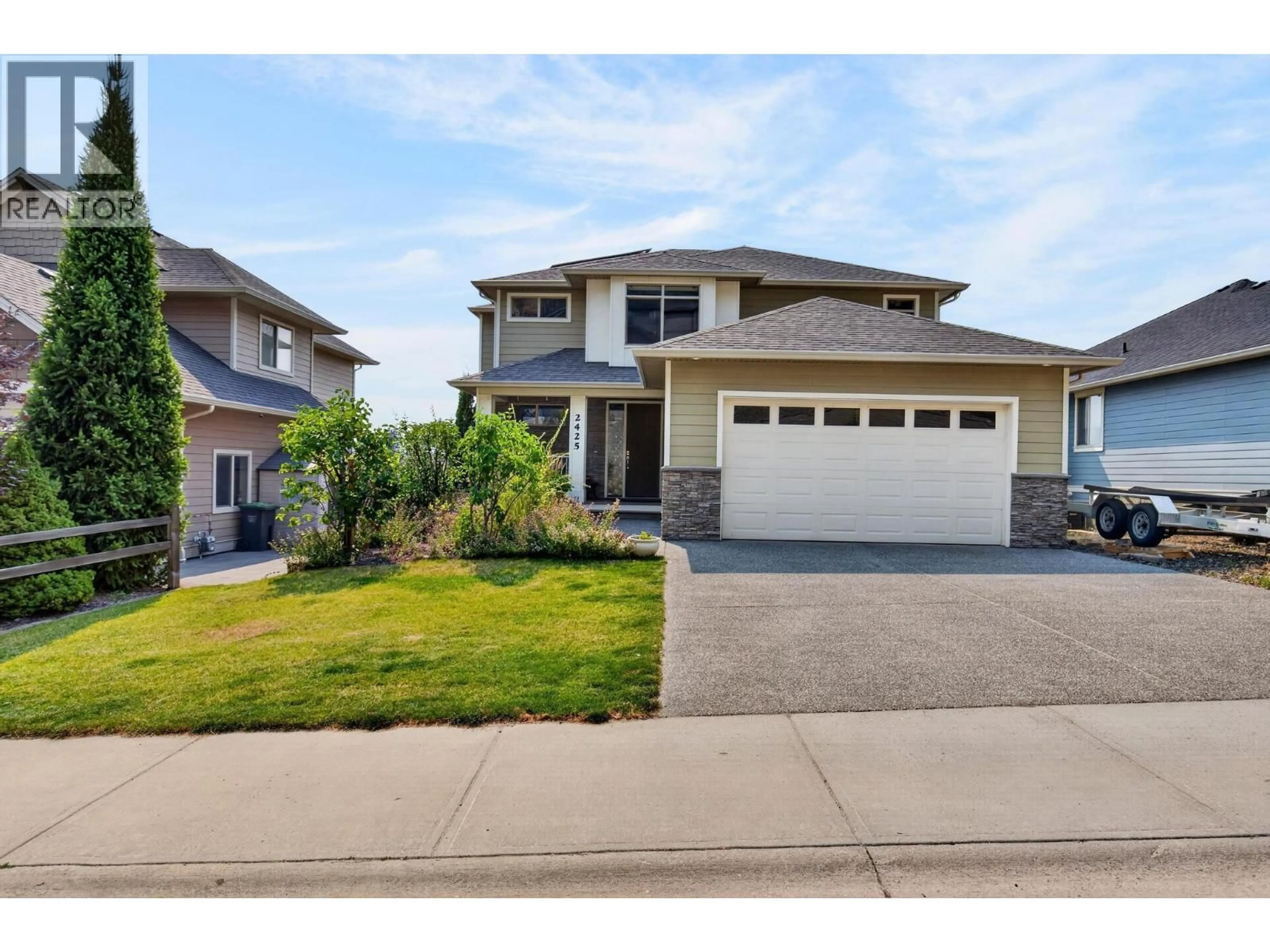Home with vinyl exterior material, street for 2425 TALLUS HEIGHTS DRIVE, West Kelowna British Columbia V4T3K4