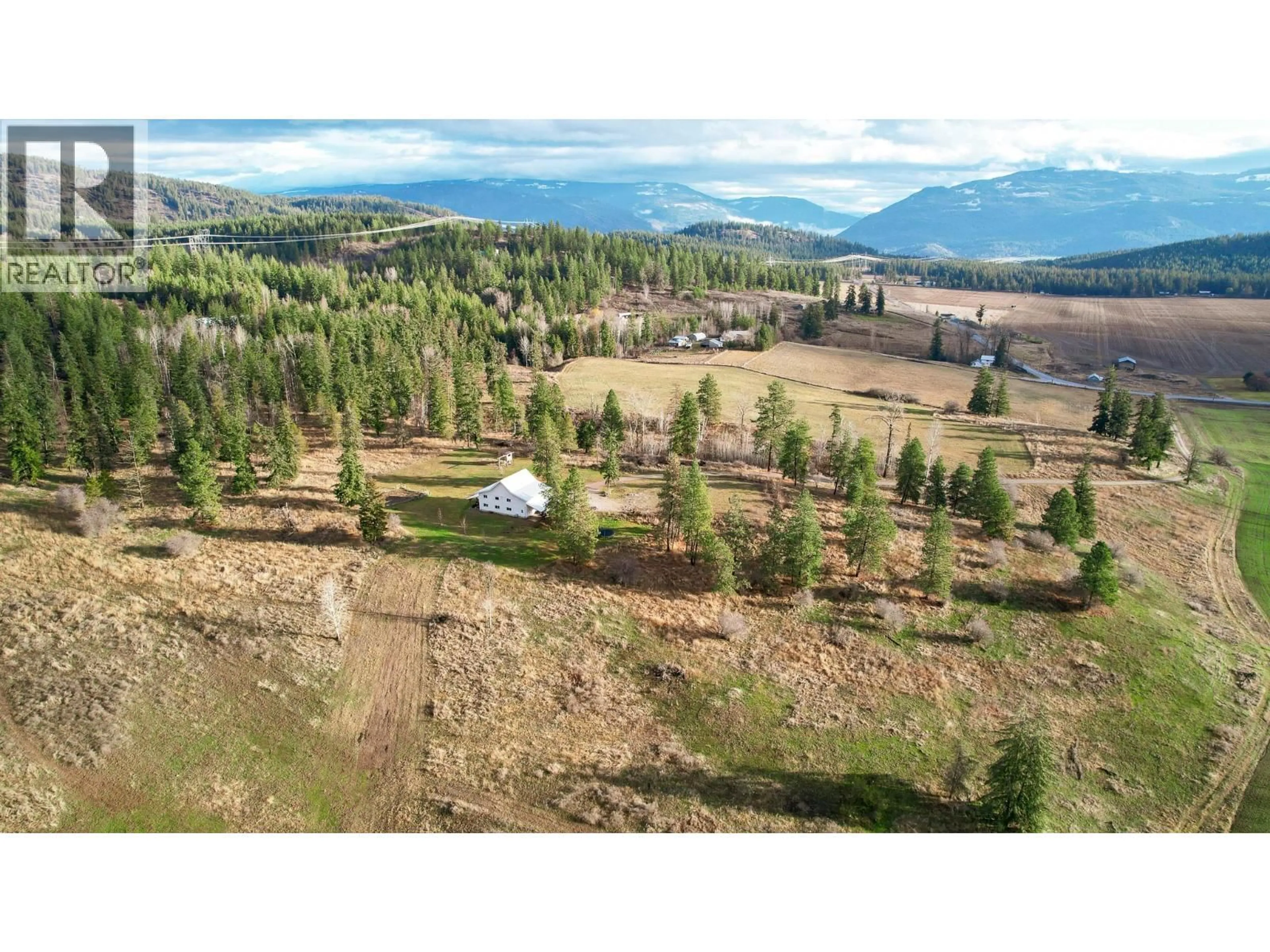 A pic from outside/outdoor area/front of a property/back of a property/a pic from drone, mountain view for 3922 HULLCAR ROAD, Armstrong British Columbia V4Y0M7