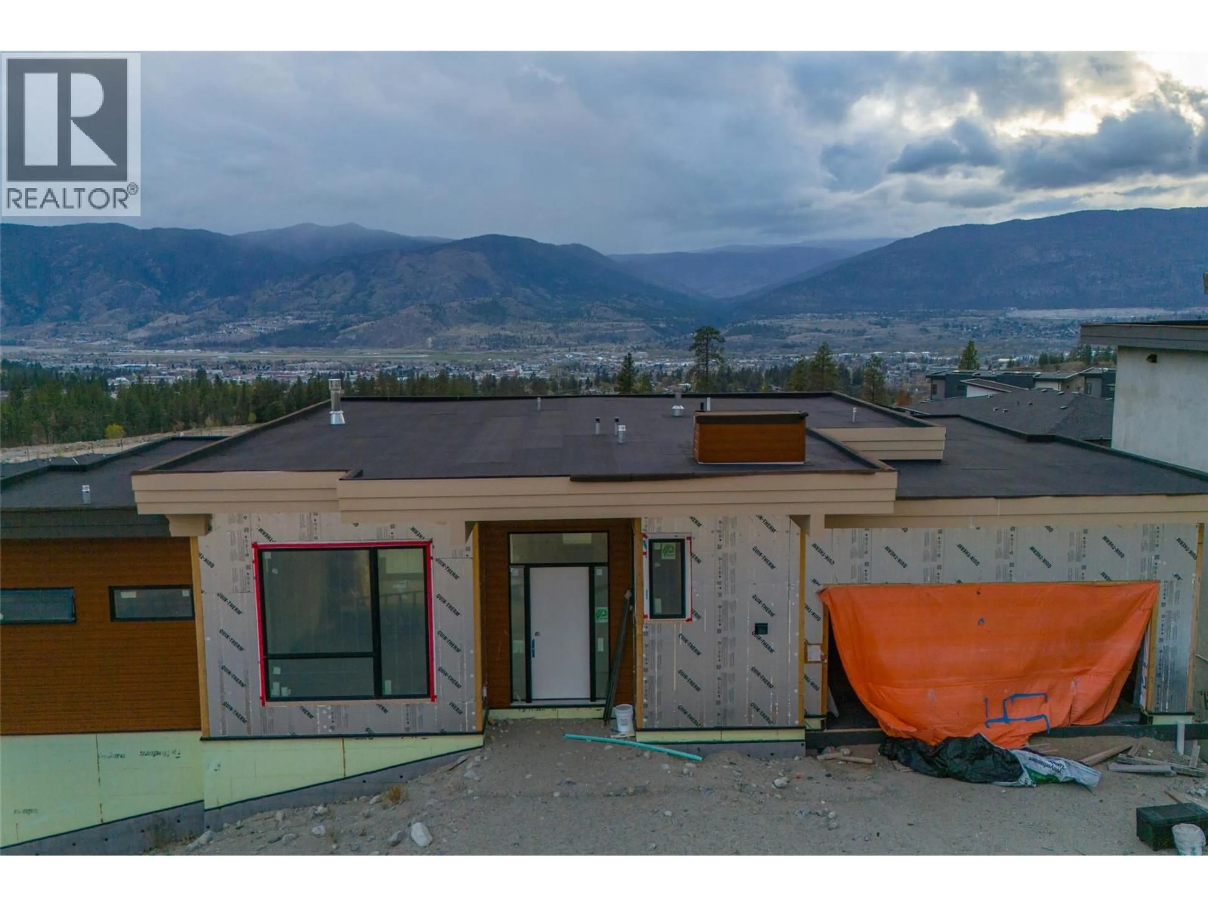 A pic from outside/outdoor area/front of a property/back of a property/a pic from drone, mountain view for 1096 ANTLER DRIVE, Penticton British Columbia V2A0C8
