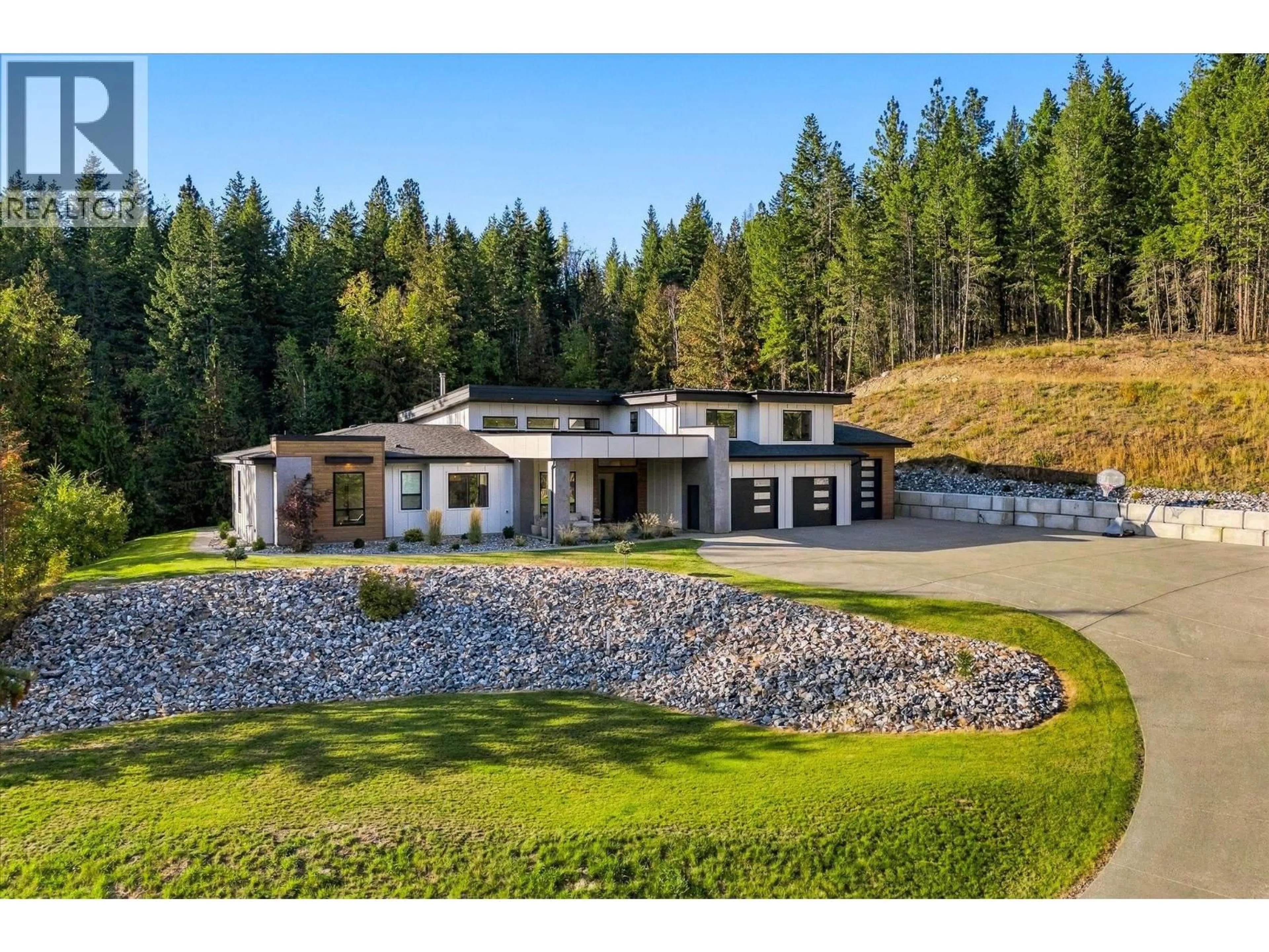 A pic from outside/outdoor area/front of a property/back of a property/a pic from drone, mountain view for 7859 BOULTER ROAD, Vernon British Columbia V1B3N2