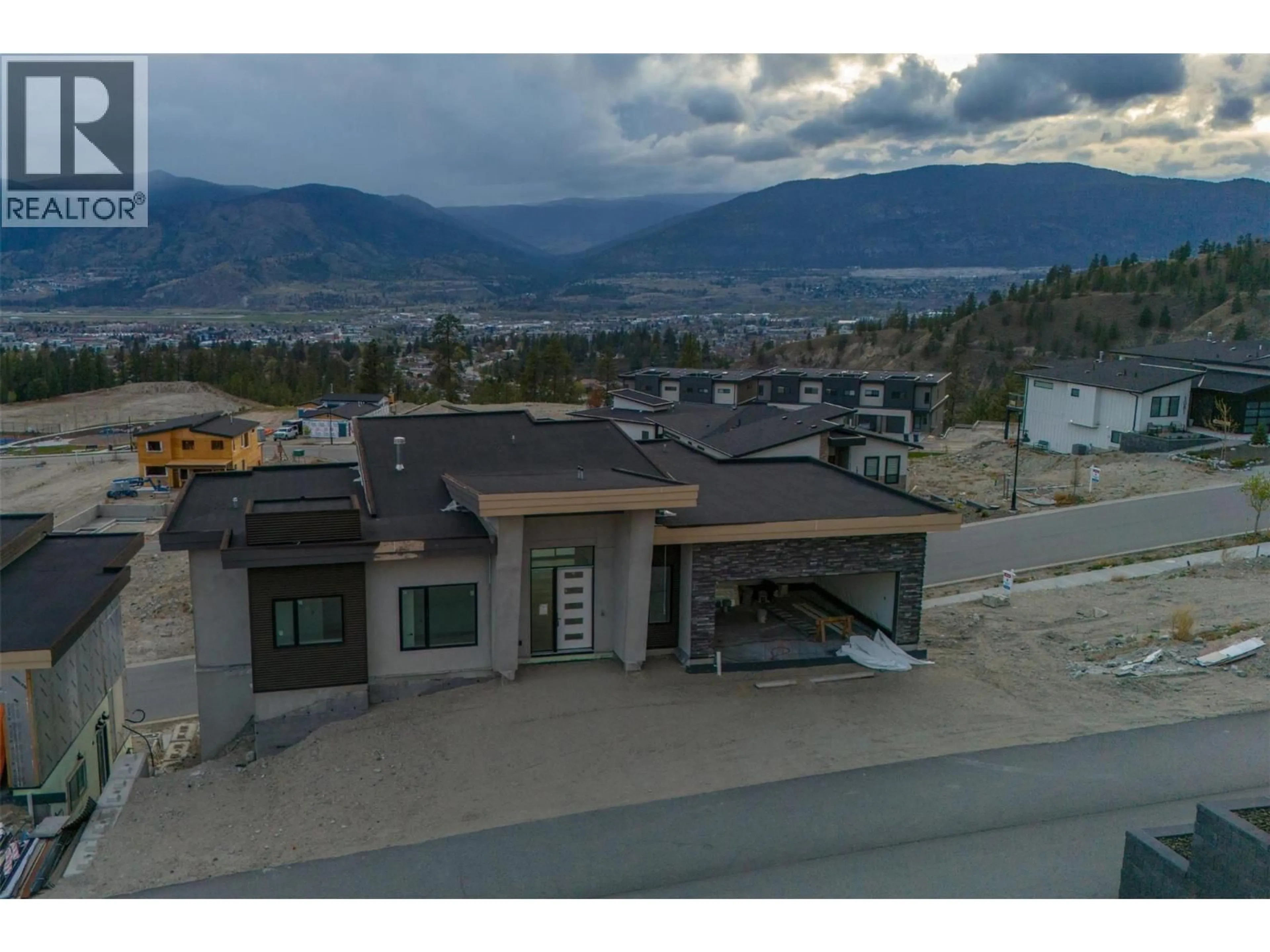 A pic from outside/outdoor area/front of a property/back of a property/a pic from drone, mountain view for 1092 ANTLER DRIVE, Penticton British Columbia V2A0J8