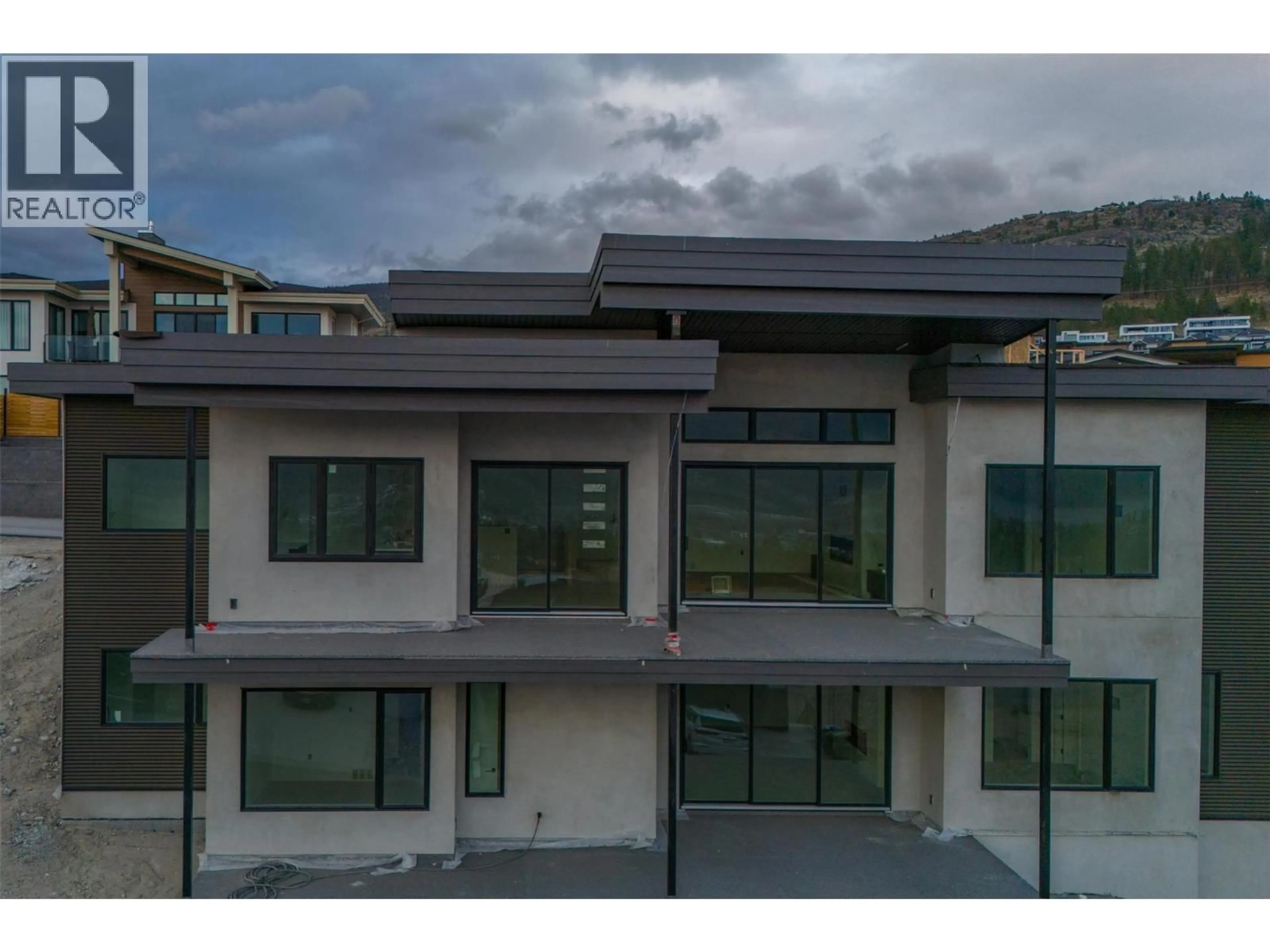 A pic from outside/outdoor area/front of a property/back of a property/a pic from drone, mountain view for 1092 ANTLER DRIVE, Penticton British Columbia V2A0J8